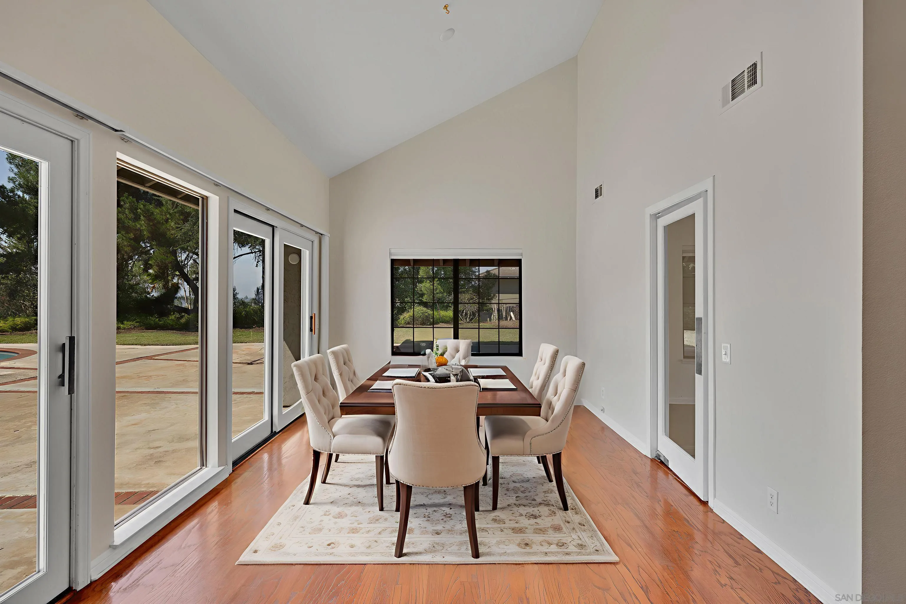 15235 Crestview Court Poway, CA 92064 - Photo 11 of 75 a dining room with furniture wooden floor and a rug