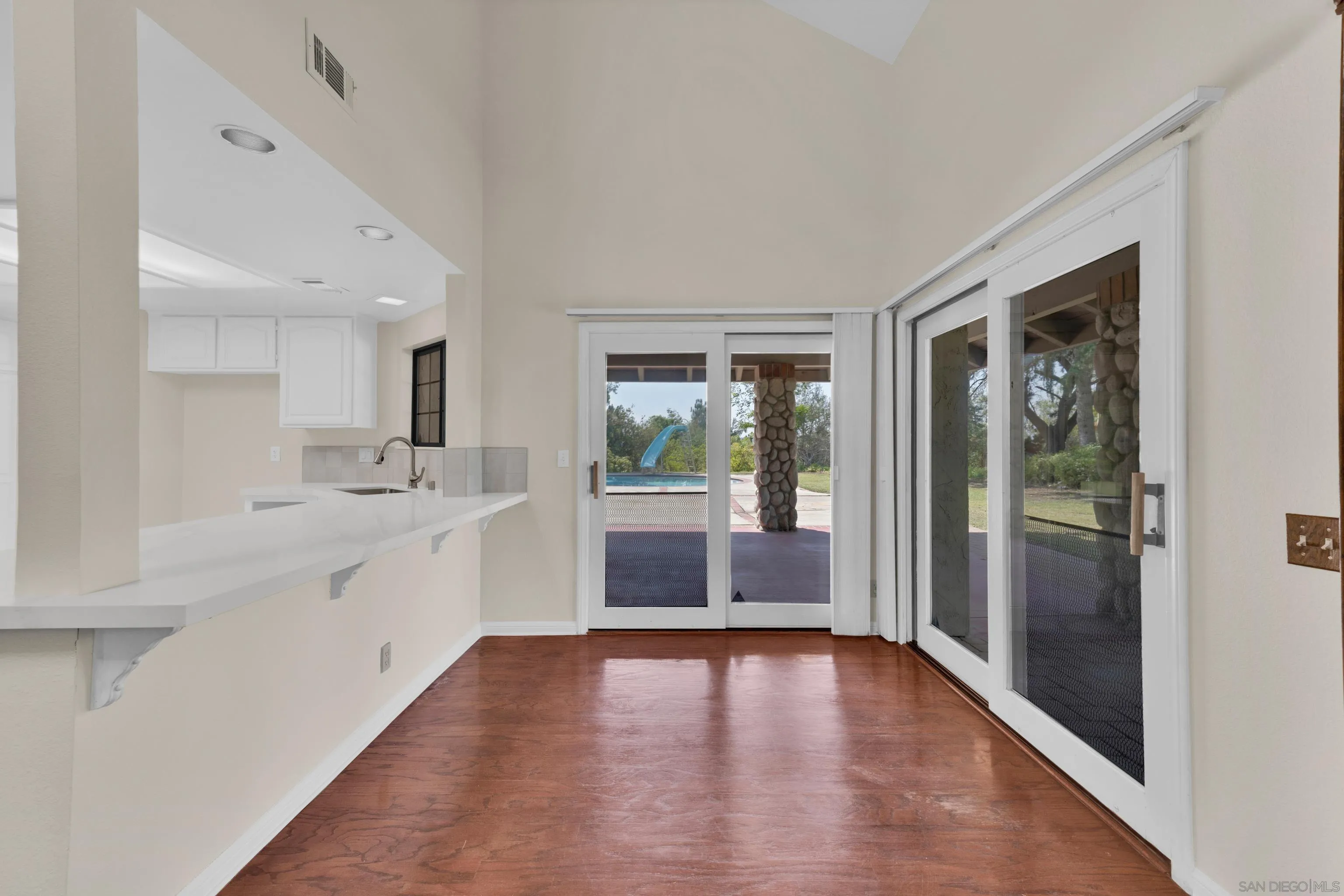 15235 Crestview Court Poway, CA 92064 - Photo 16 of 75 a large white kitchen with a sink and dish washer