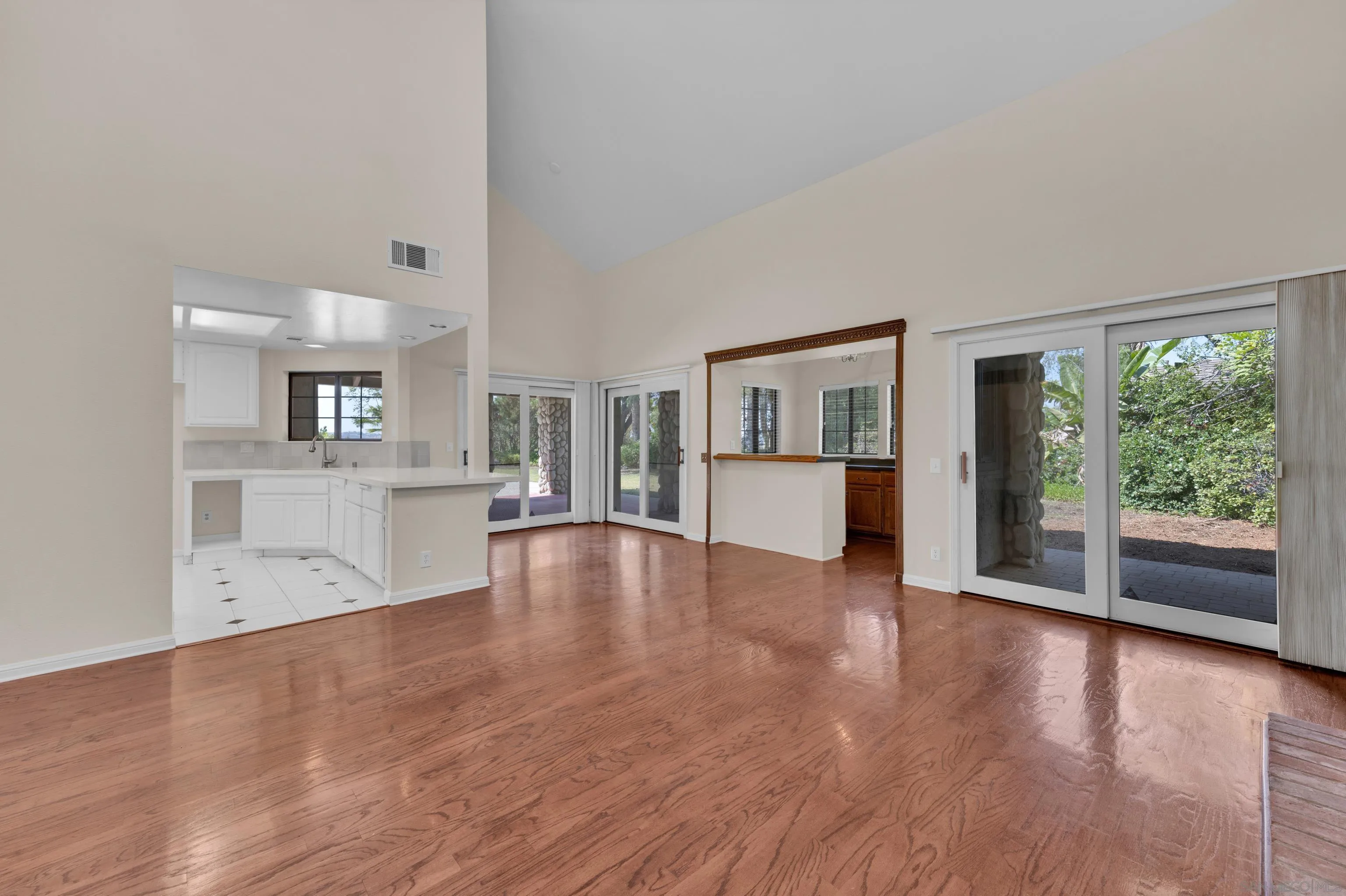 15235 Crestview Court Poway, CA 92064 - Photo 18 of 75 a view of a living room hardwood floor and a kitchen