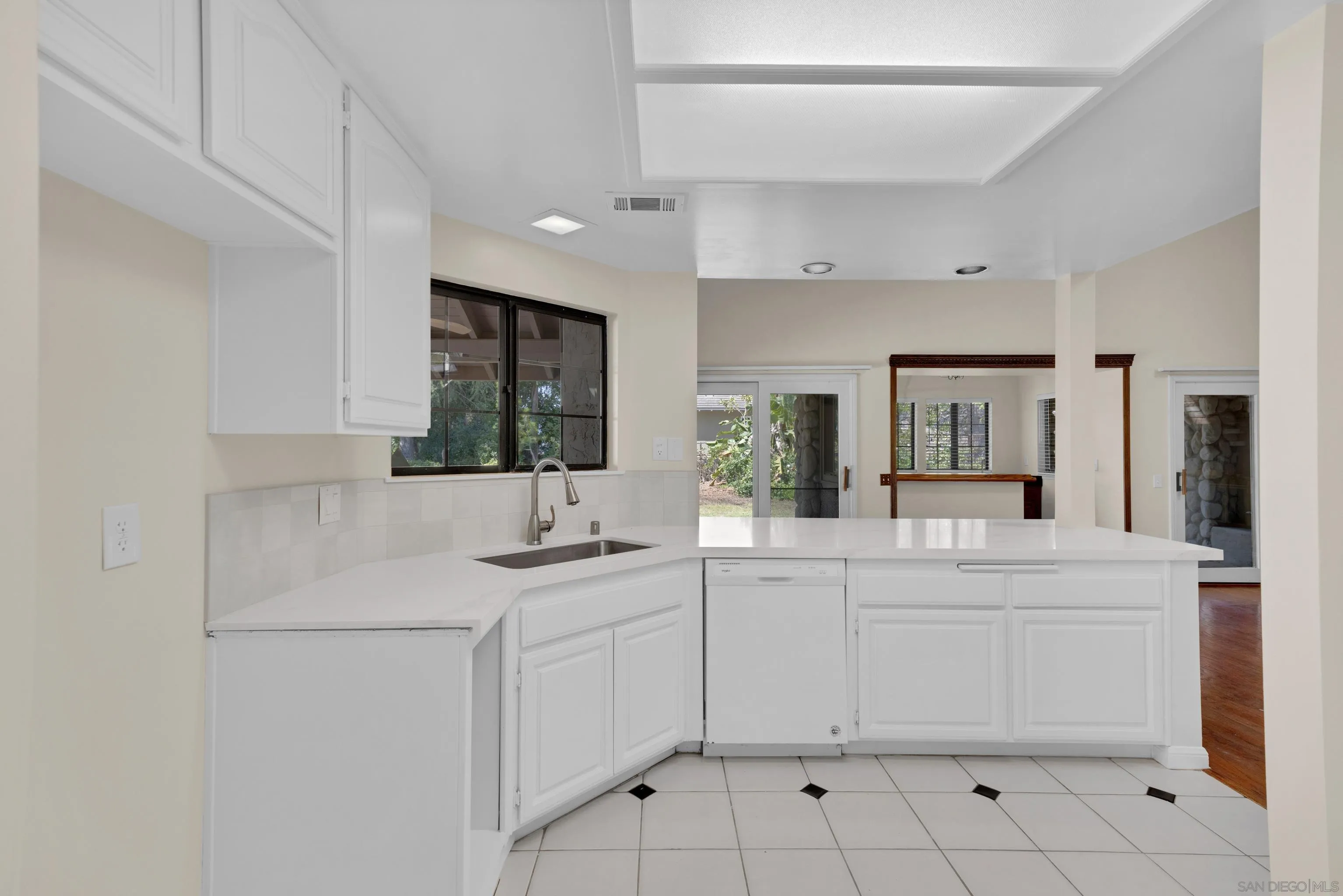 15235 Crestview Court Poway, CA 92064 - Photo 22 of 75 a kitchen with a sink and chairs