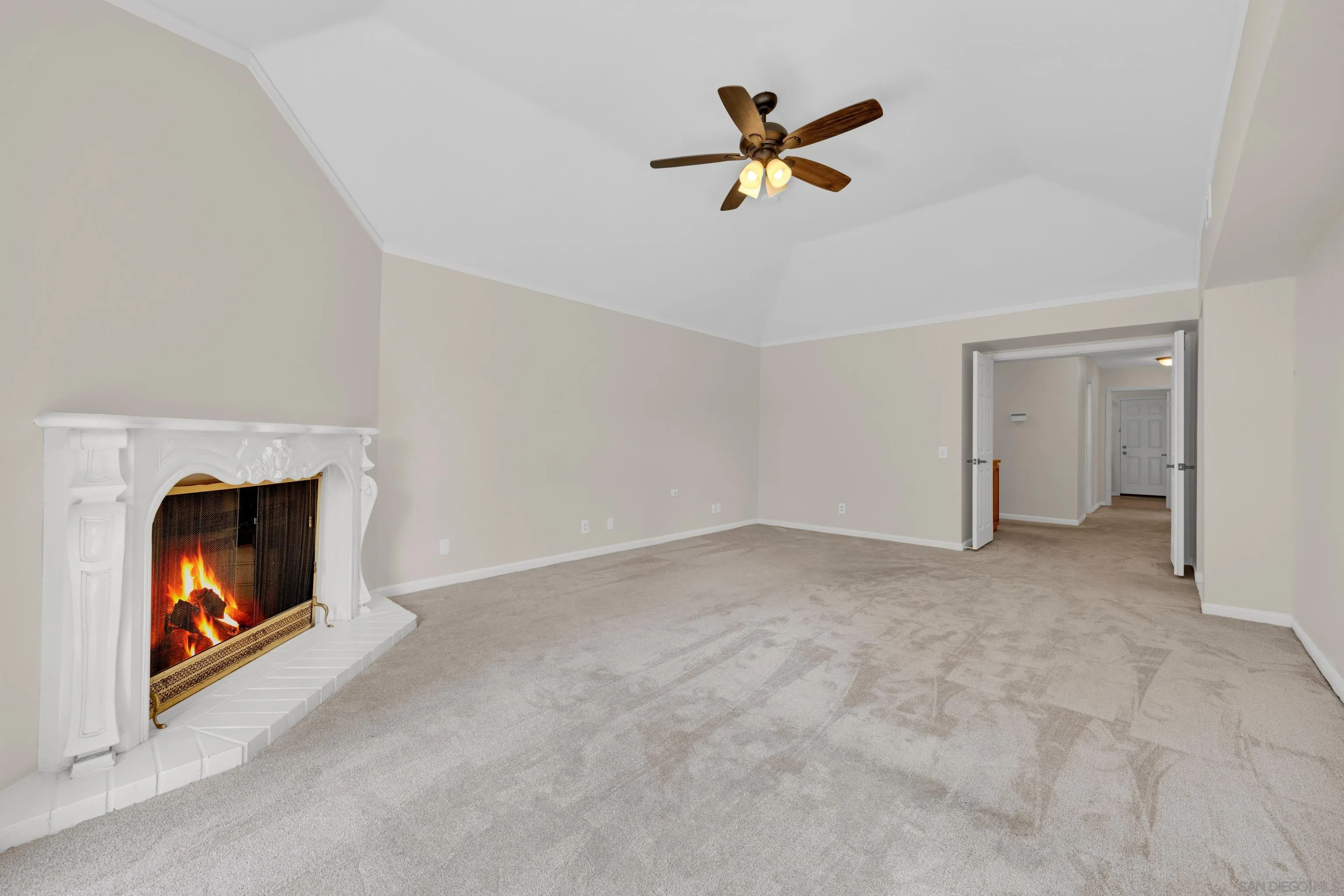 15235 Crestview Court Poway, CA 92064 - Photo 25 of 75 a view of a livingroom with a fireplace and a ceiling fan