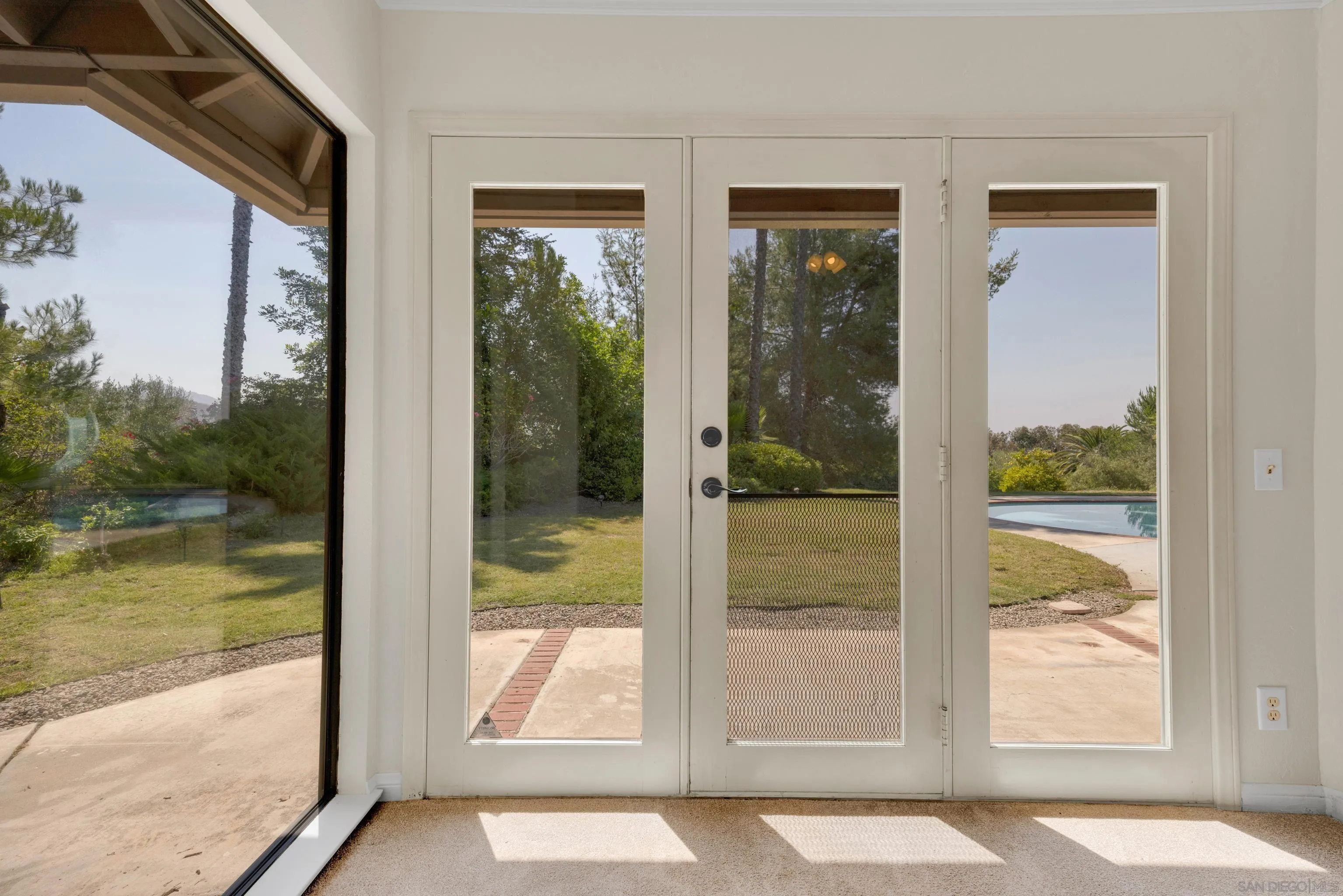 15235 Crestview Court Poway, CA 92064 - Photo 29 of 75 a view of a glass door and a window