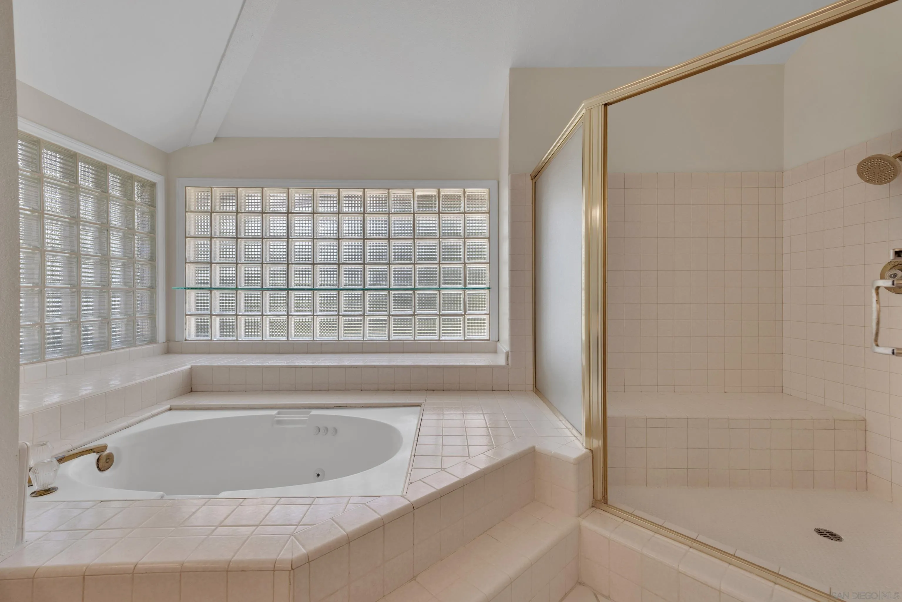 15235 Crestview Court Poway, CA 92064 - Photo 32 of 75 a bathroom with a bathtub and a shower