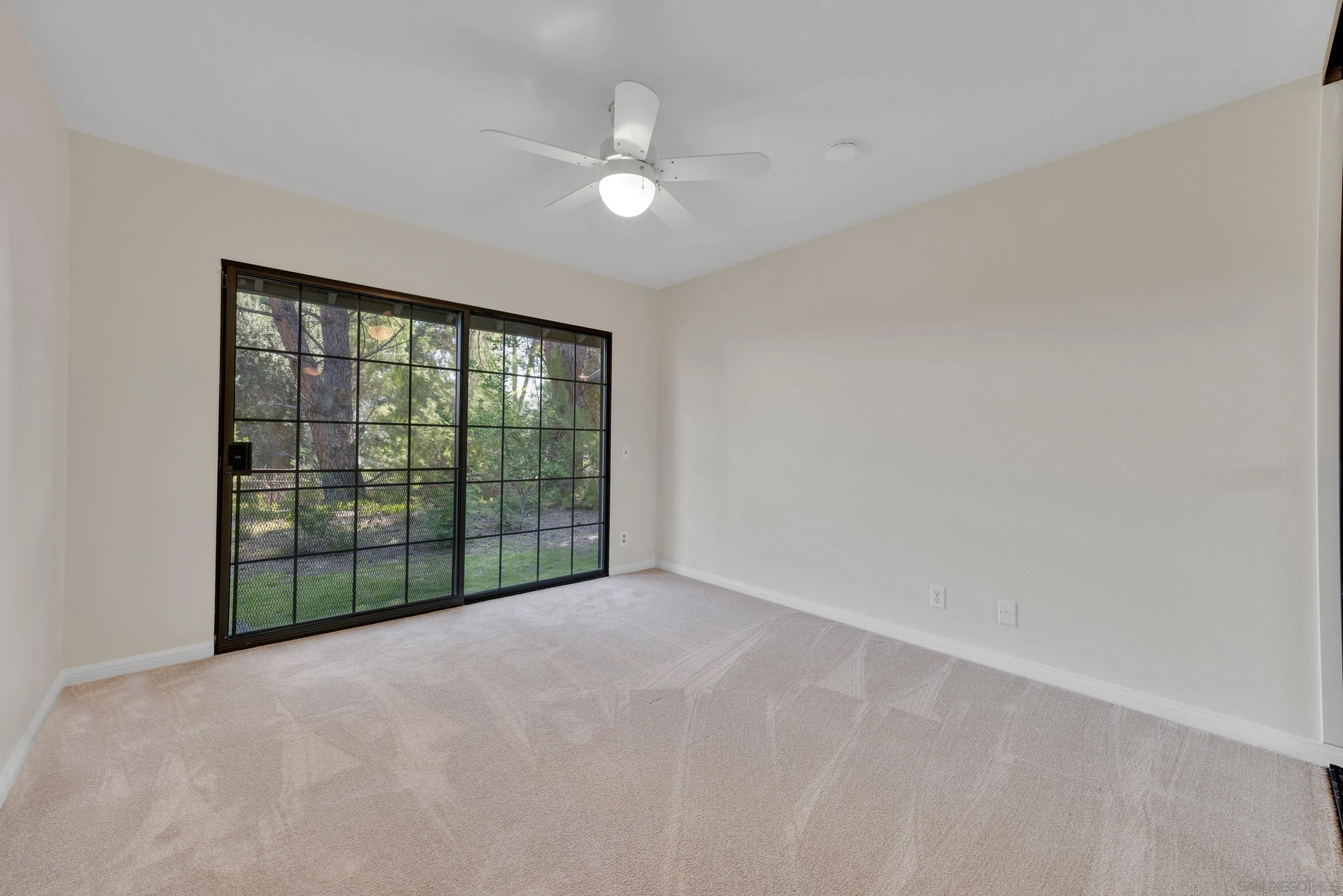 15235 Crestview Court Poway, CA 92064 - Photo 35 of 75 a view of a big room with windows and chandelier fan