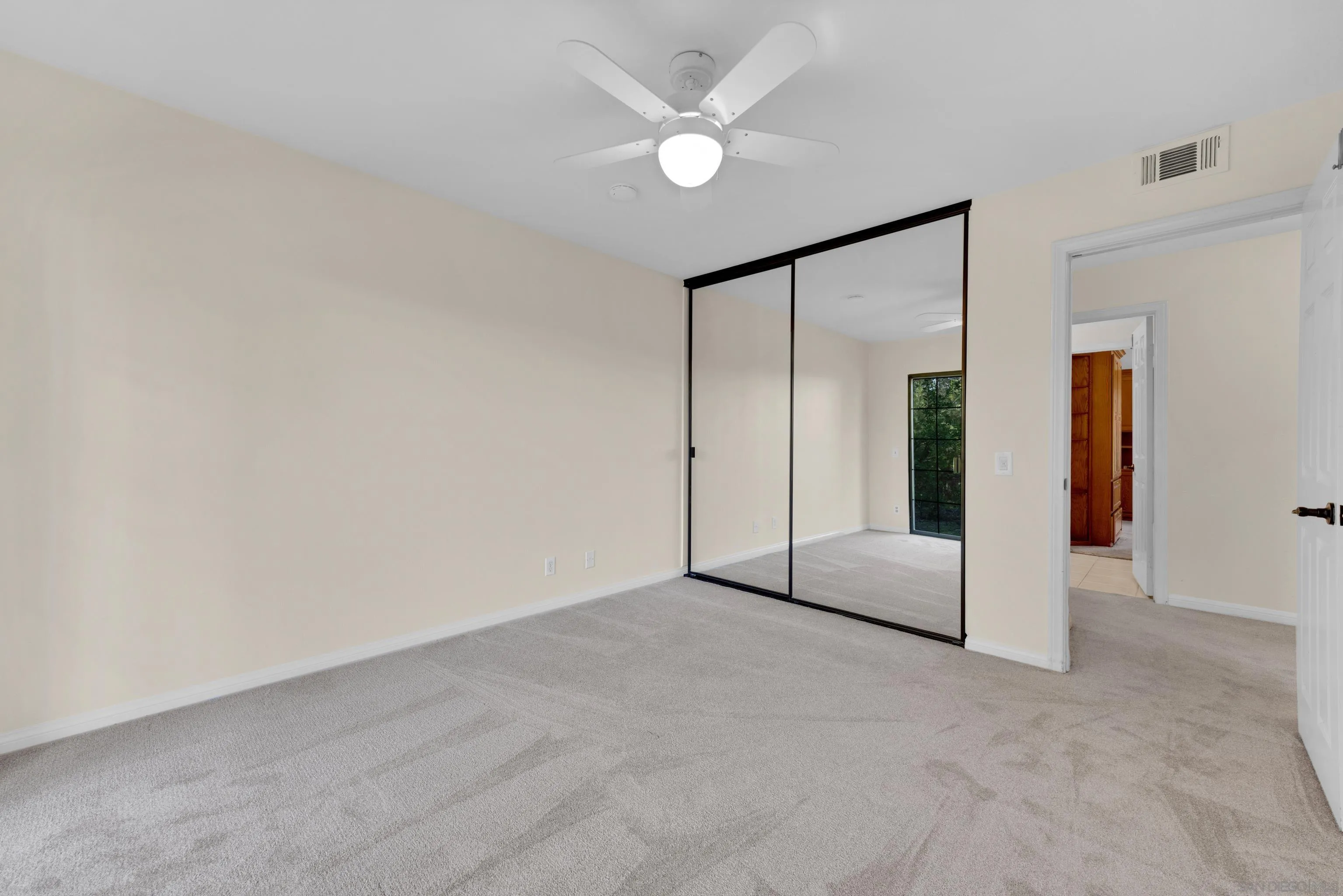 15235 Crestview Court Poway, CA 92064 - Photo 37 of 75 an empty room with closet and windows