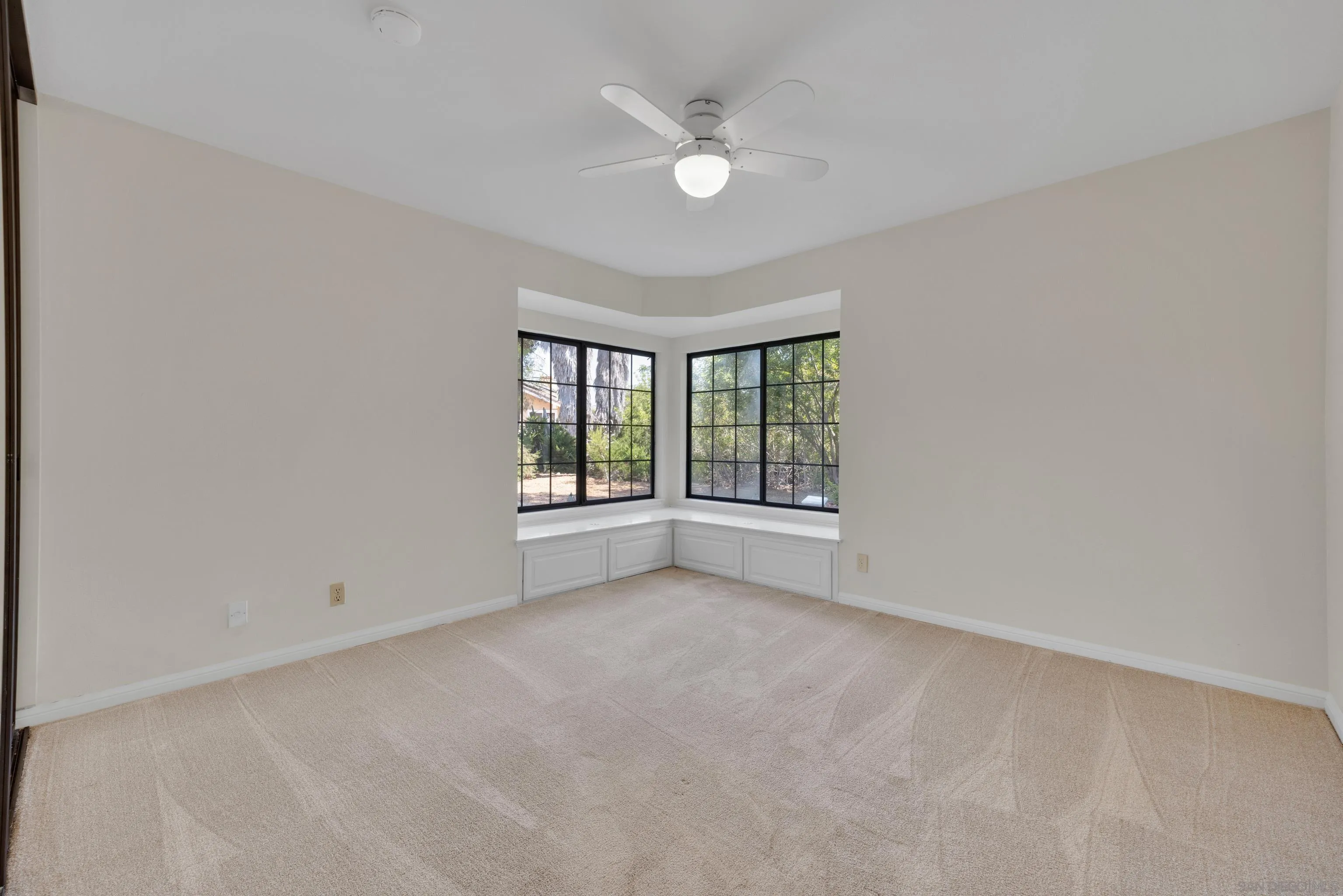 15235 Crestview Court Poway, CA 92064 - Photo 38 of 75 an empty room with windows and ceiling fan