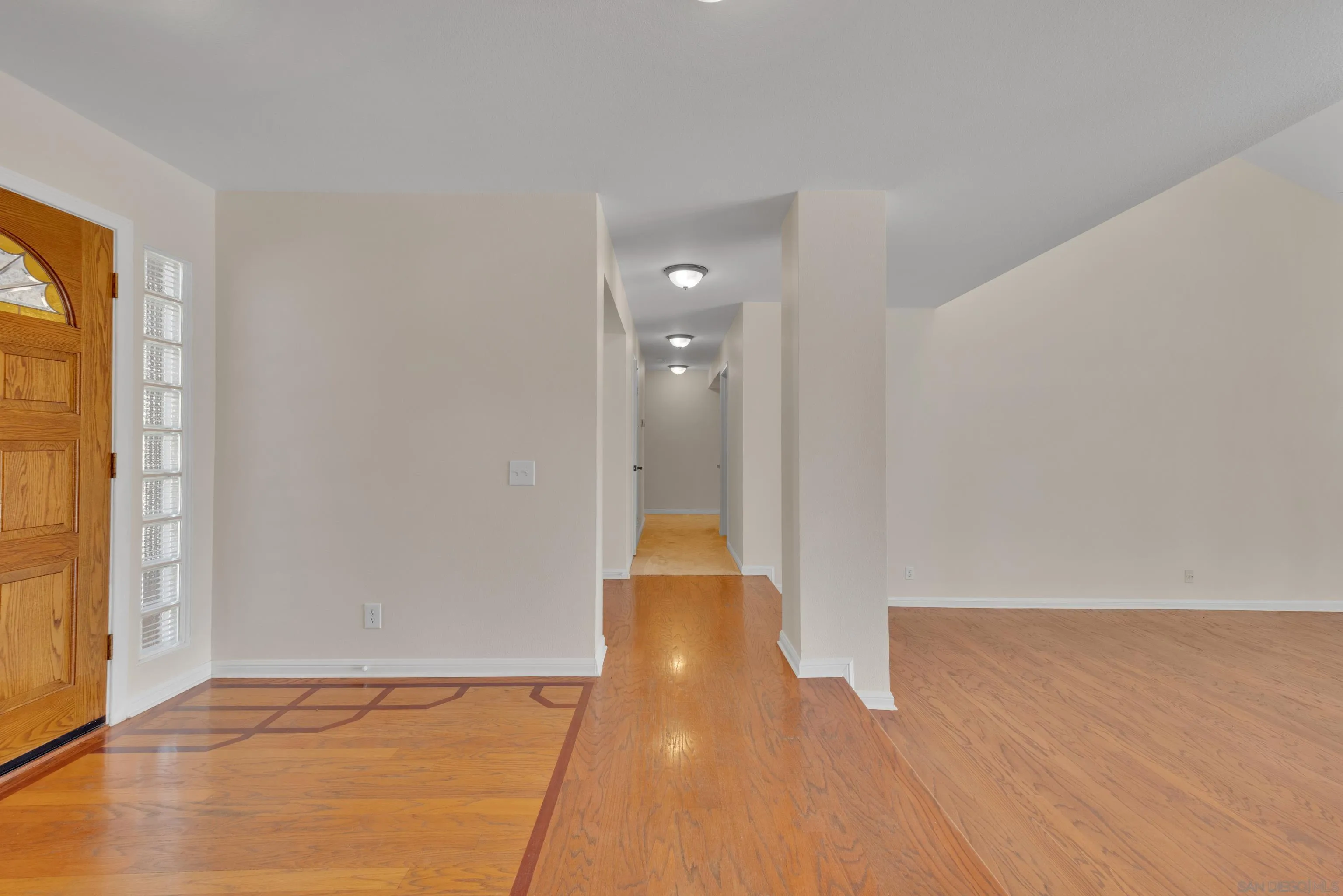 15235 Crestview Court Poway, CA 92064 - Photo 43 of 75 a view of an empty room with wooden floor and a window