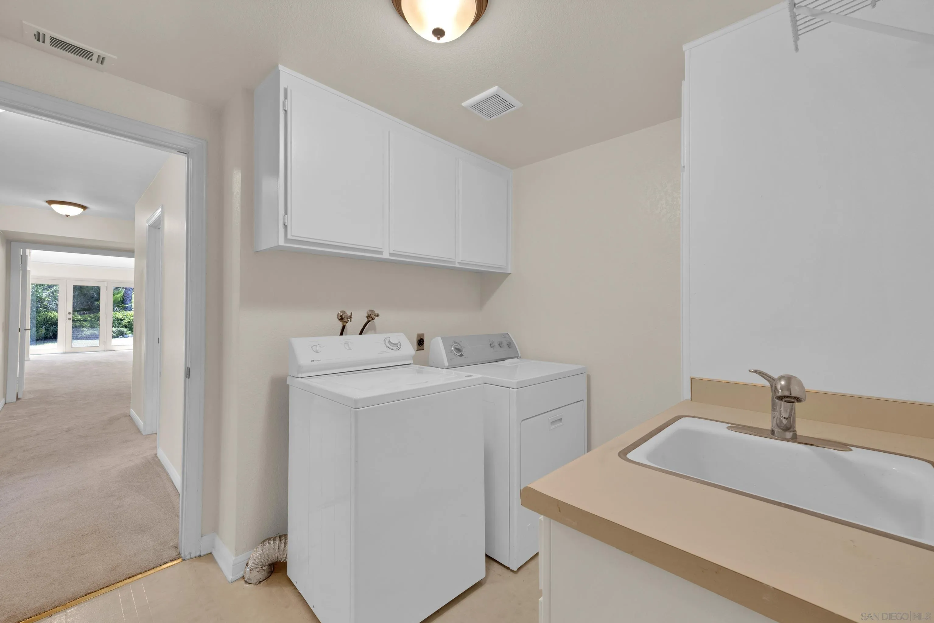 15235 Crestview Court Poway, CA 92064 - Photo 54 of 75 a utility room with dryer and washer