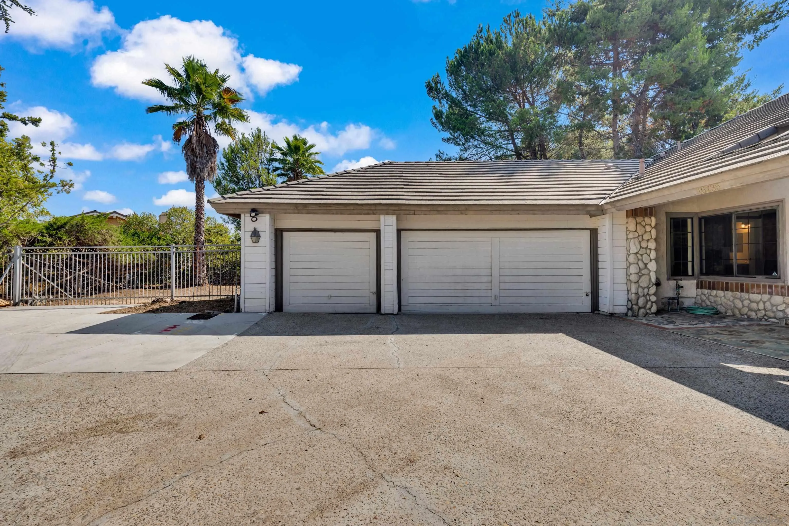15235 Crestview Court Poway, CA 92064 - Photo 55 of 75 a front view of a house with a yard and garage