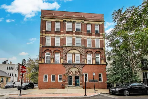 a front view of a building and a street