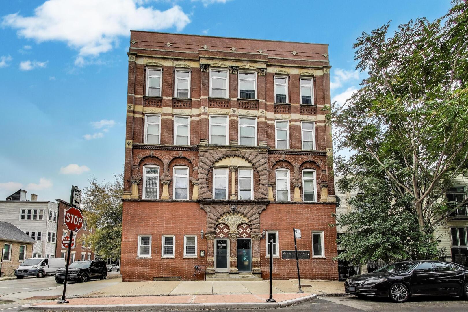 1521 North Paulina Street, Unit 1F Chicago, IL 60622 - Photo 1 of 21 a front view of a building and a street