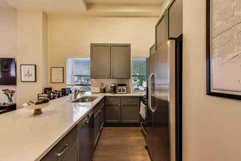 a kitchen with a sink stove and refrigerator