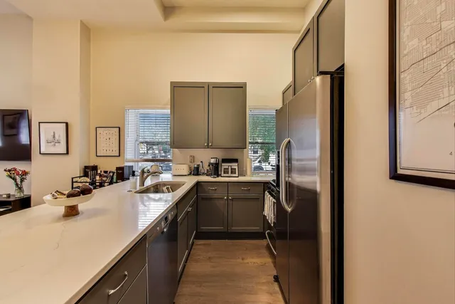 a kitchen with a sink stove and refrigerator