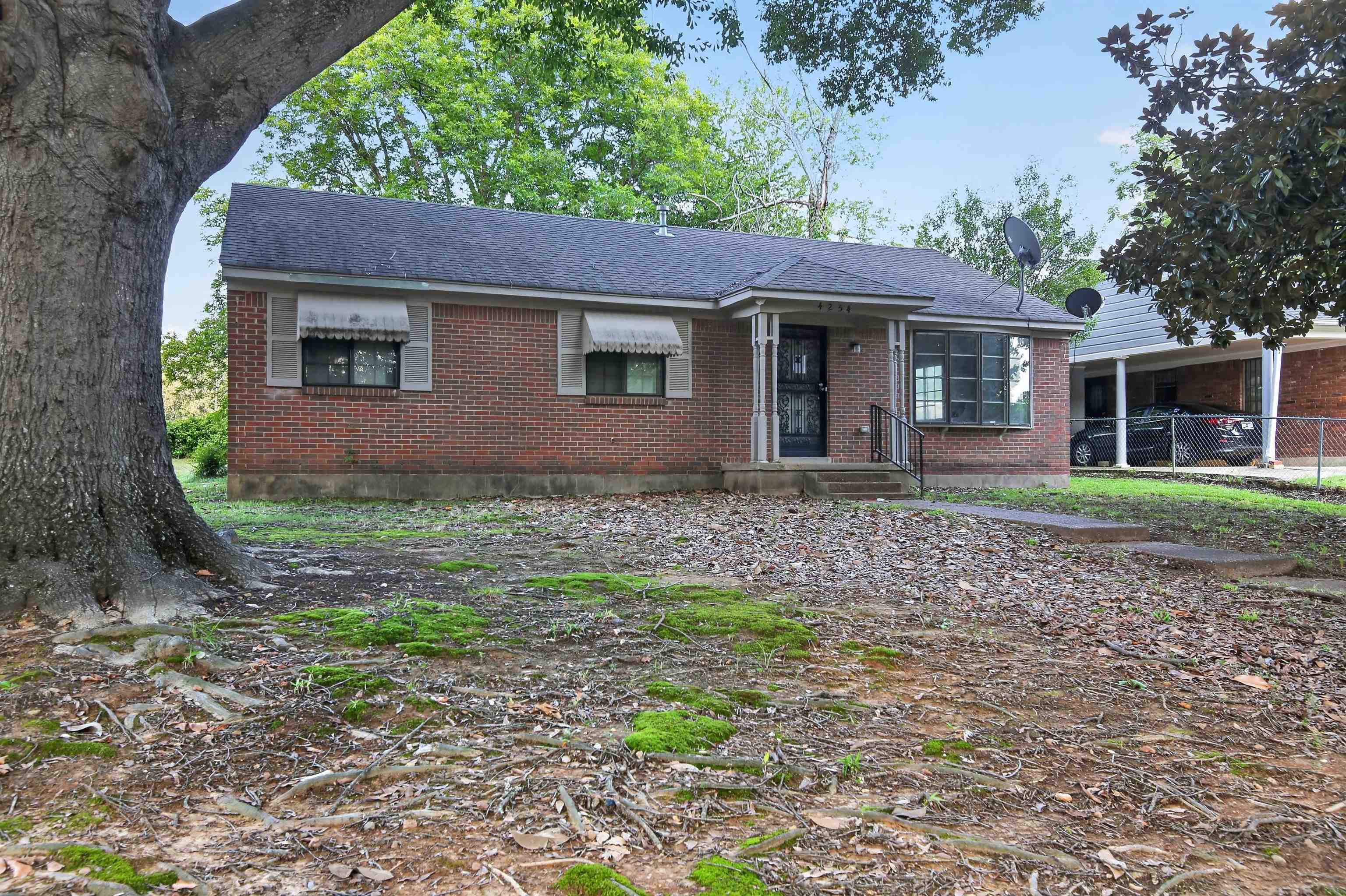 4254 Sidney Road Memphis, TN 38116 - Photo 7 of 23 a front view of a house with garden