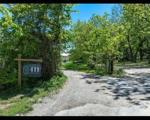a sign that is sitting on a rock
