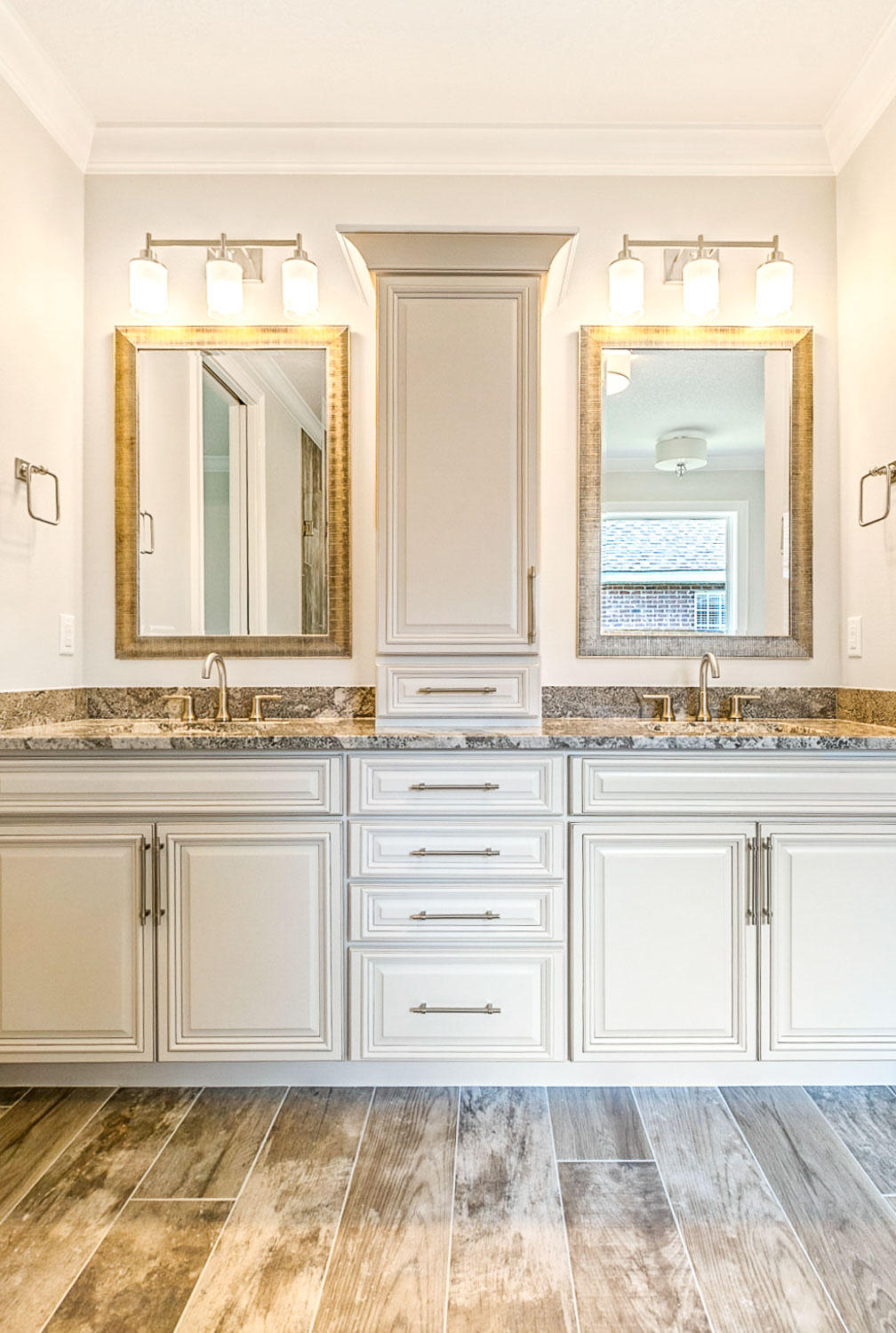 4809 Grove Street Crestview, FL 32539 - Photo 18 of 28 a bathroom with a granite countertop sink and a mirror