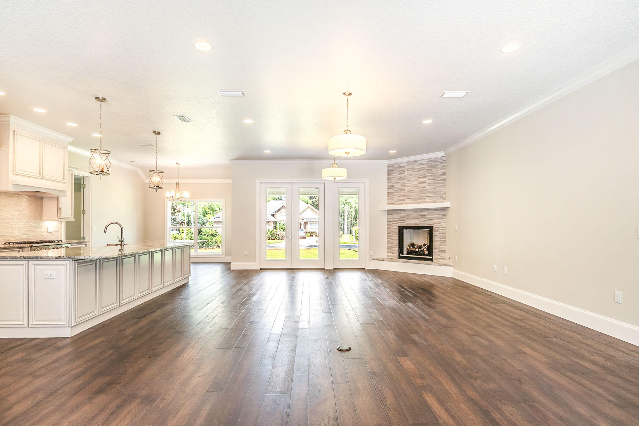 4809 Grove Street Crestview, FL 32539 - Photo 22 of 28 an empty room with wooden floor and fireplace