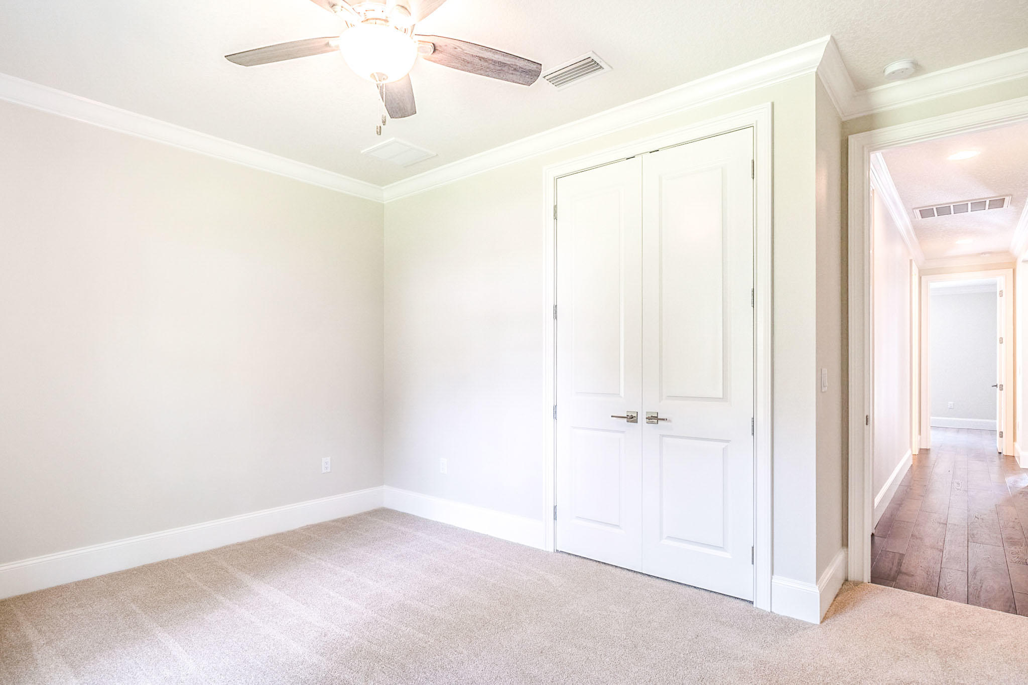 4809 Grove Street Crestview, FL 32539 - Photo 24 of 28 an empty room with a chandelier fan
