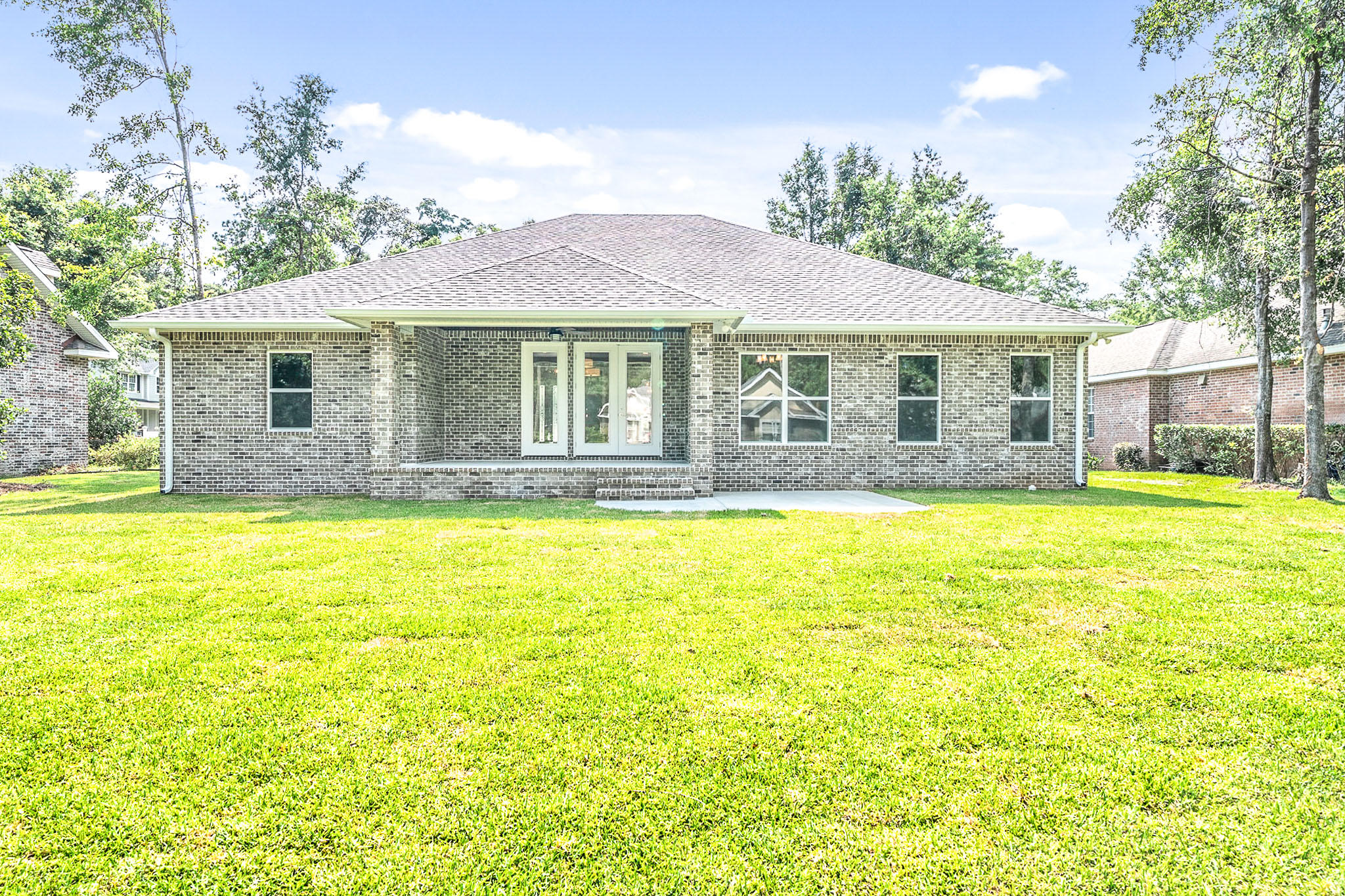 4809 Grove Street Crestview, FL 32539 - Photo 5 of 28 a front view of a house with a swimming pool