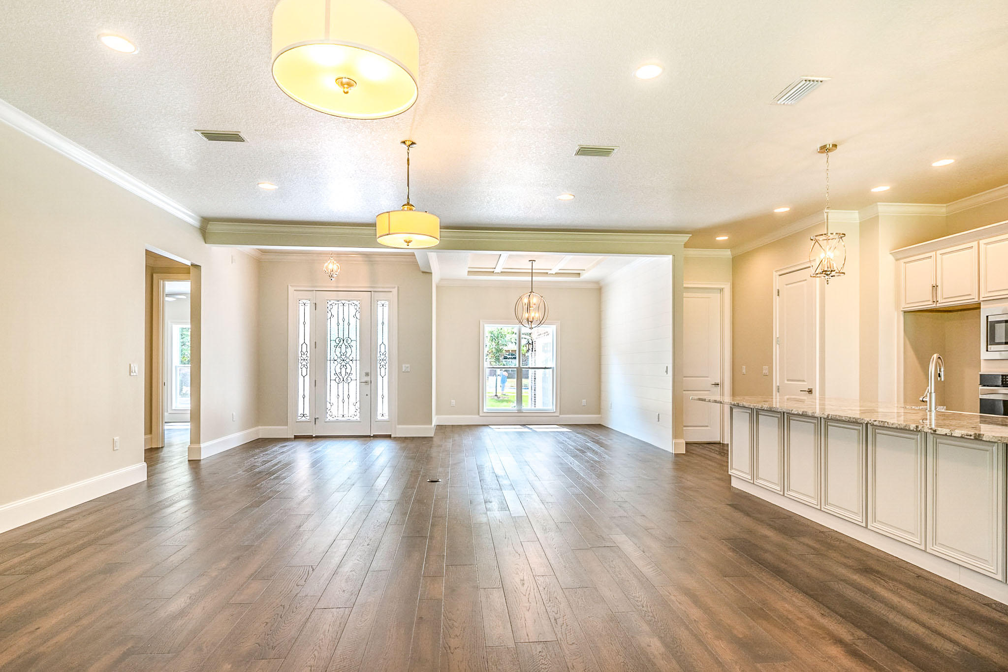 4809 Grove Street Crestview, FL 32539 - Photo 9 of 28 a view of an empty room with wooden floor and a window