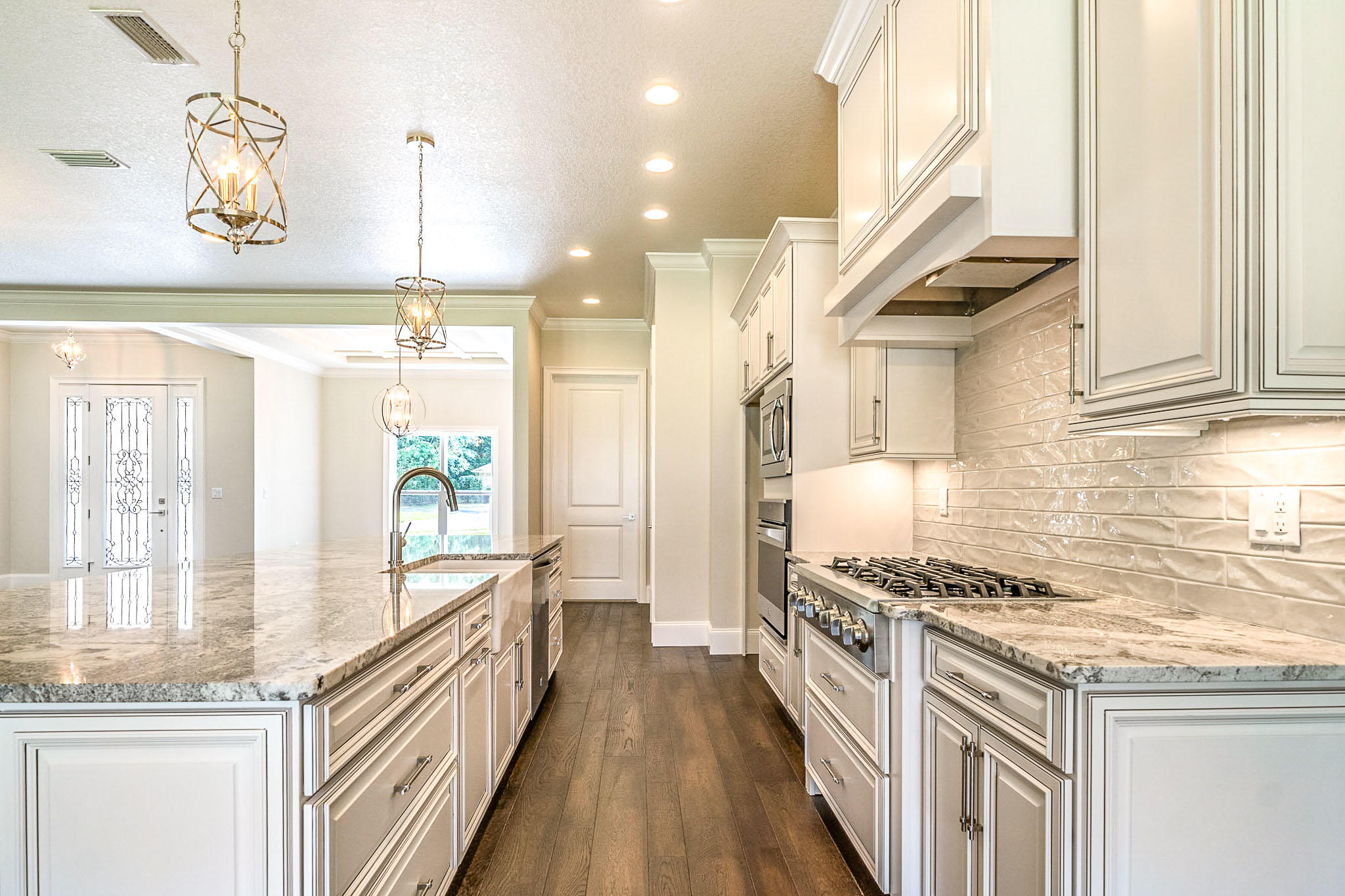 4809 Grove Street Crestview, FL 32539 - Photo 10 of 28 a kitchen with granite countertop a stove and a sink