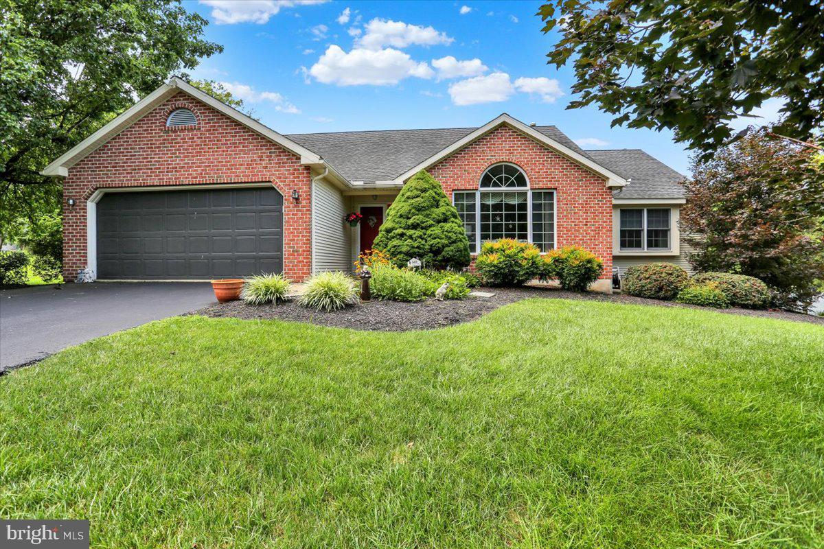 12 Archer Lane Reading, PA 19607 - Photo 1 of 39 a front view of a house with a yard and garage