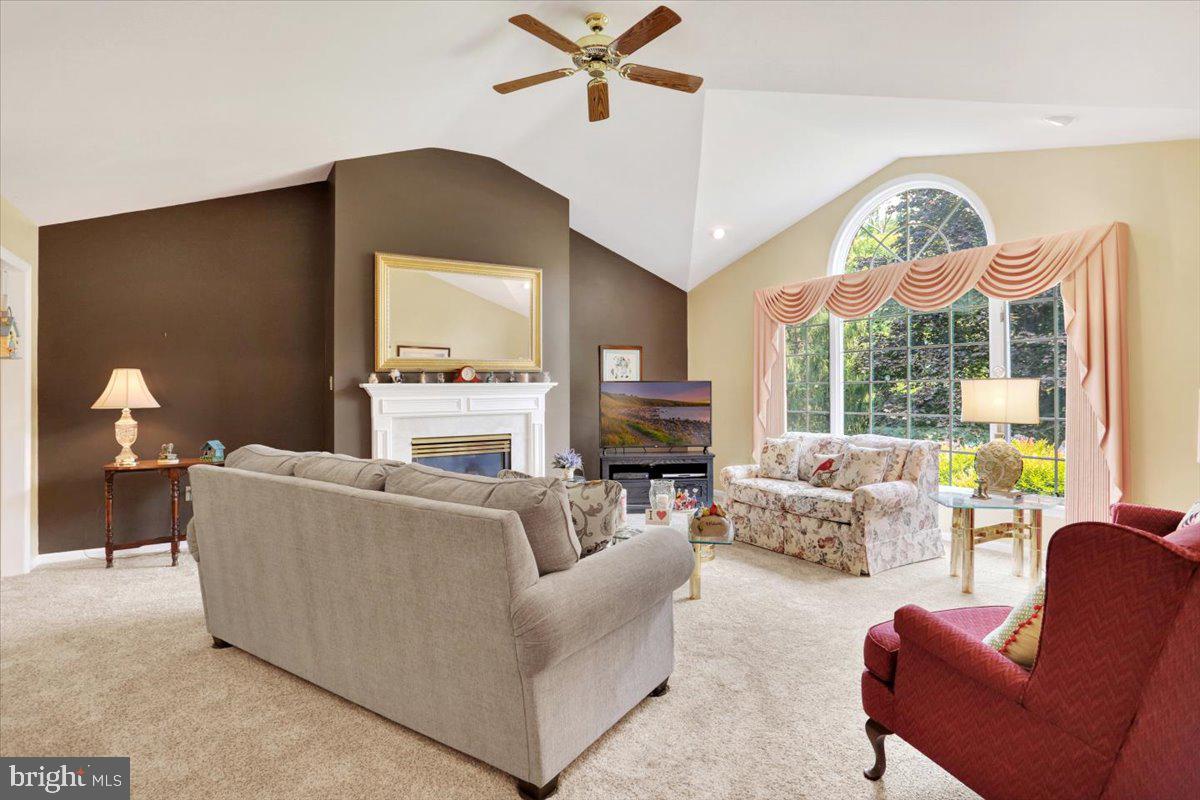 12 Archer Lane Reading, PA 19607 - Photo 15 of 39 a living room with furniture a fireplace and a large window