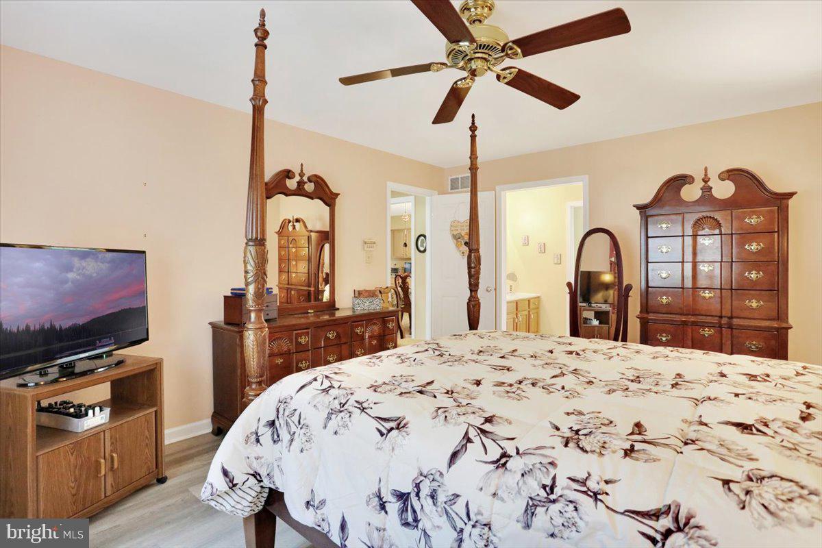 12 Archer Lane Reading, PA 19607 - Photo 18 of 39 a bedroom with a bed dresser and a flat tv screen
