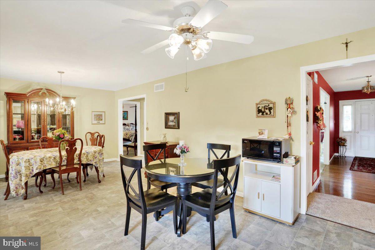 12 Archer Lane Reading, PA 19607 - Photo 24 of 39 a view of a dining room with furniture and chandelier