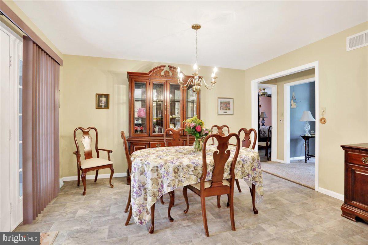 12 Archer Lane Reading, PA 19607 - Photo 25 of 39 a view of a dining room with furniture and chandelier