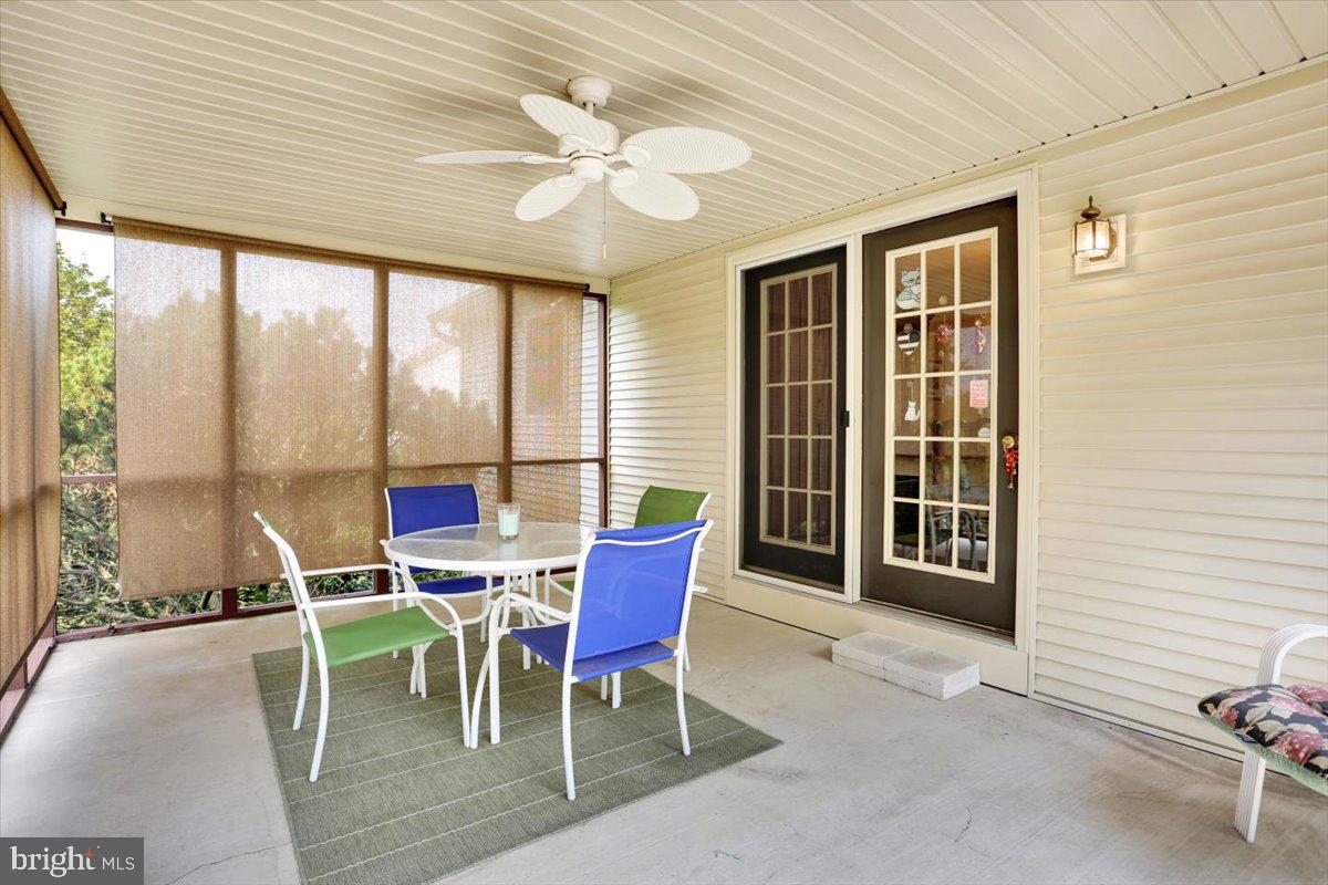 12 Archer Lane Reading, PA 19607 - Photo 26 of 39 a dining room with furniture large windows and wooden floor