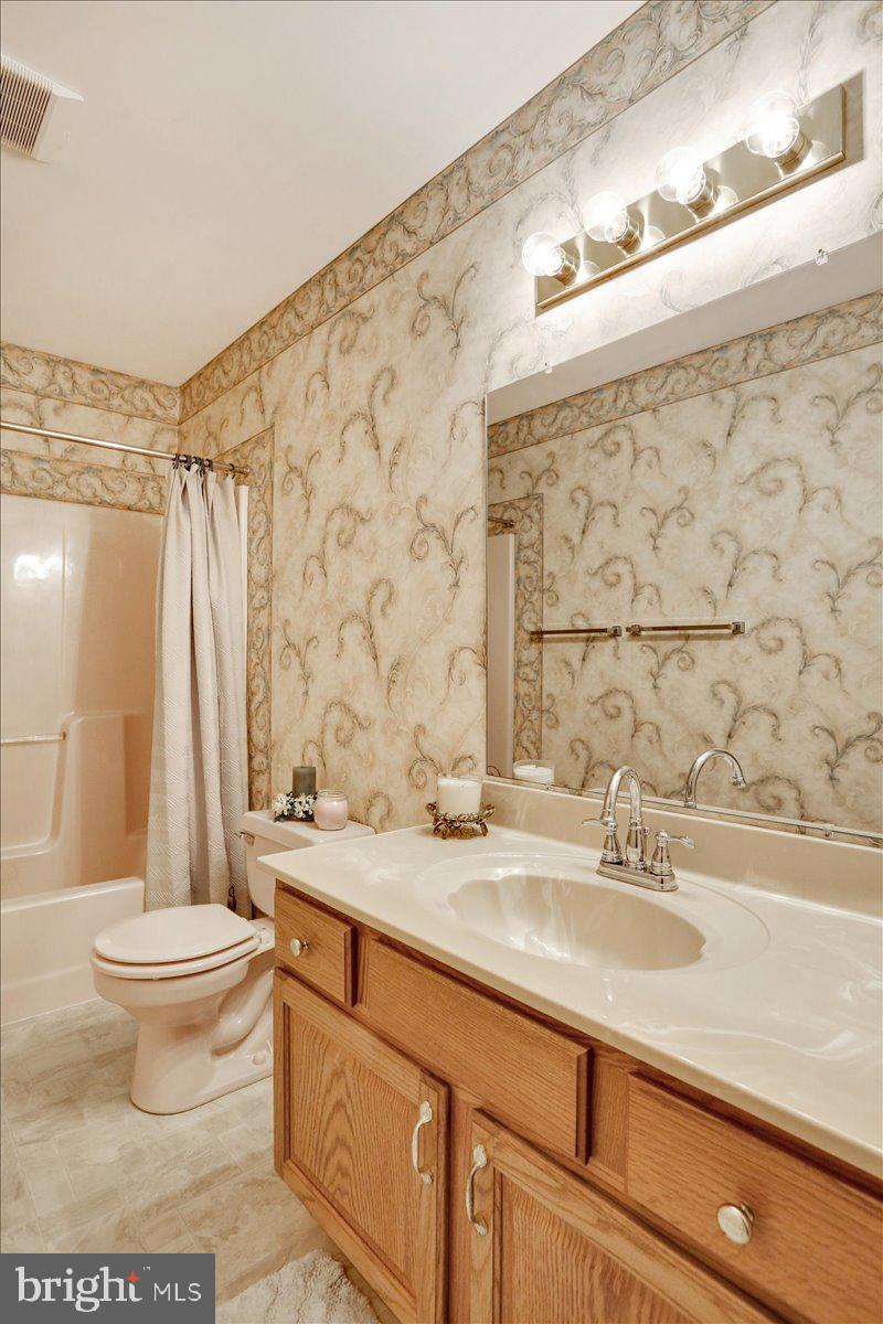 12 Archer Lane Reading, PA 19607 - Photo 30 of 39 a bathroom with a granite countertop sink toilet and shower