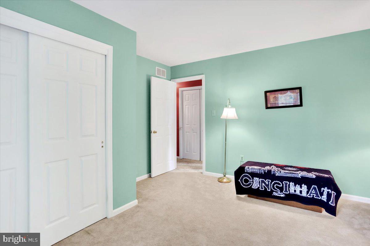 12 Archer Lane Reading, PA 19607 - Photo 32 of 39 a bedroom with a bed and a painting on the wall