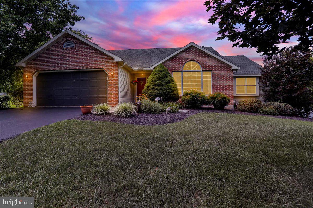 12 Archer Lane Reading, PA 19607 - Photo 5 of 39 a front view of a house with a yard and garage