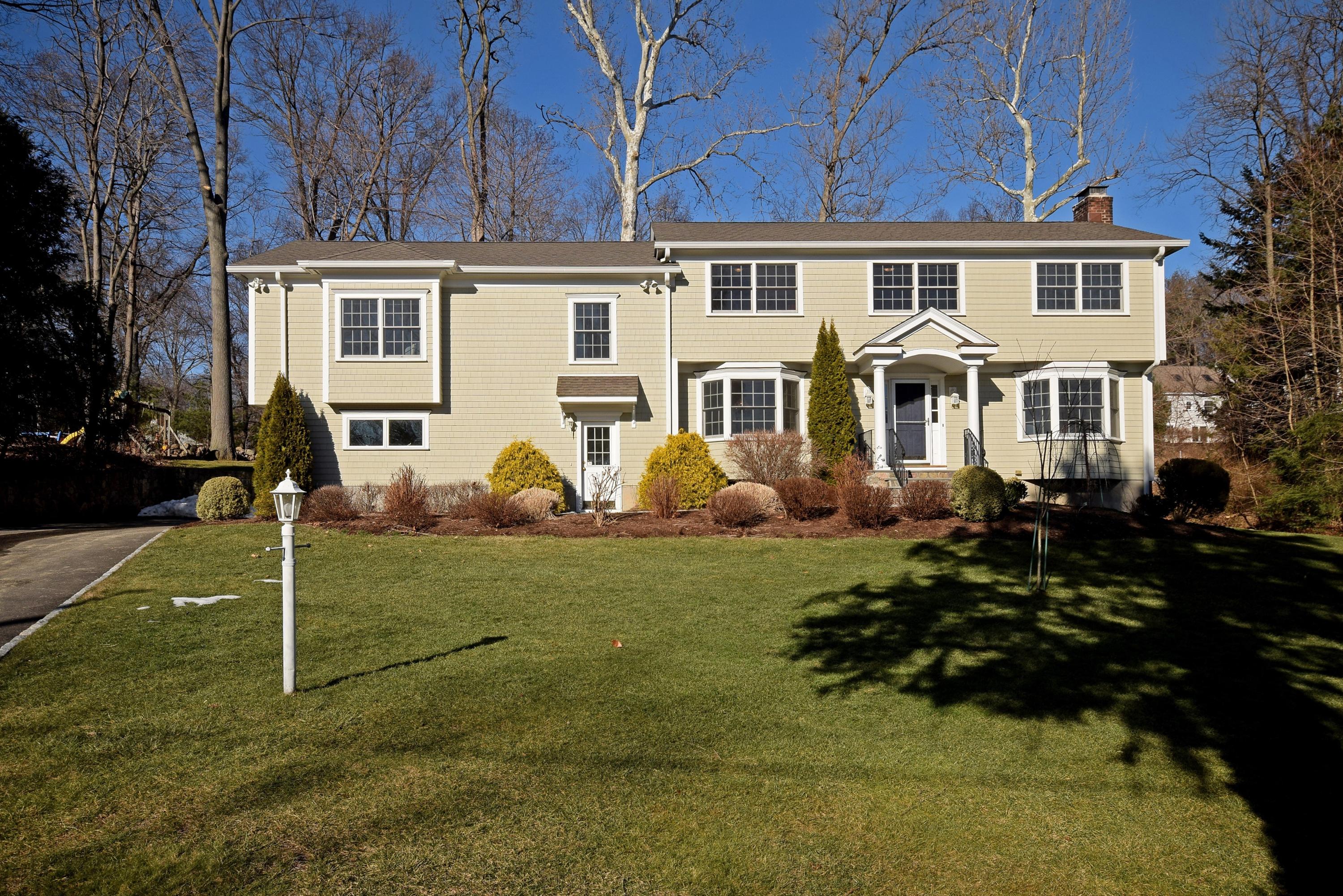 6 Wilson Ridge Road East Darien, CT 06820 - Photo 1 of 25 a view of a white house with a yard