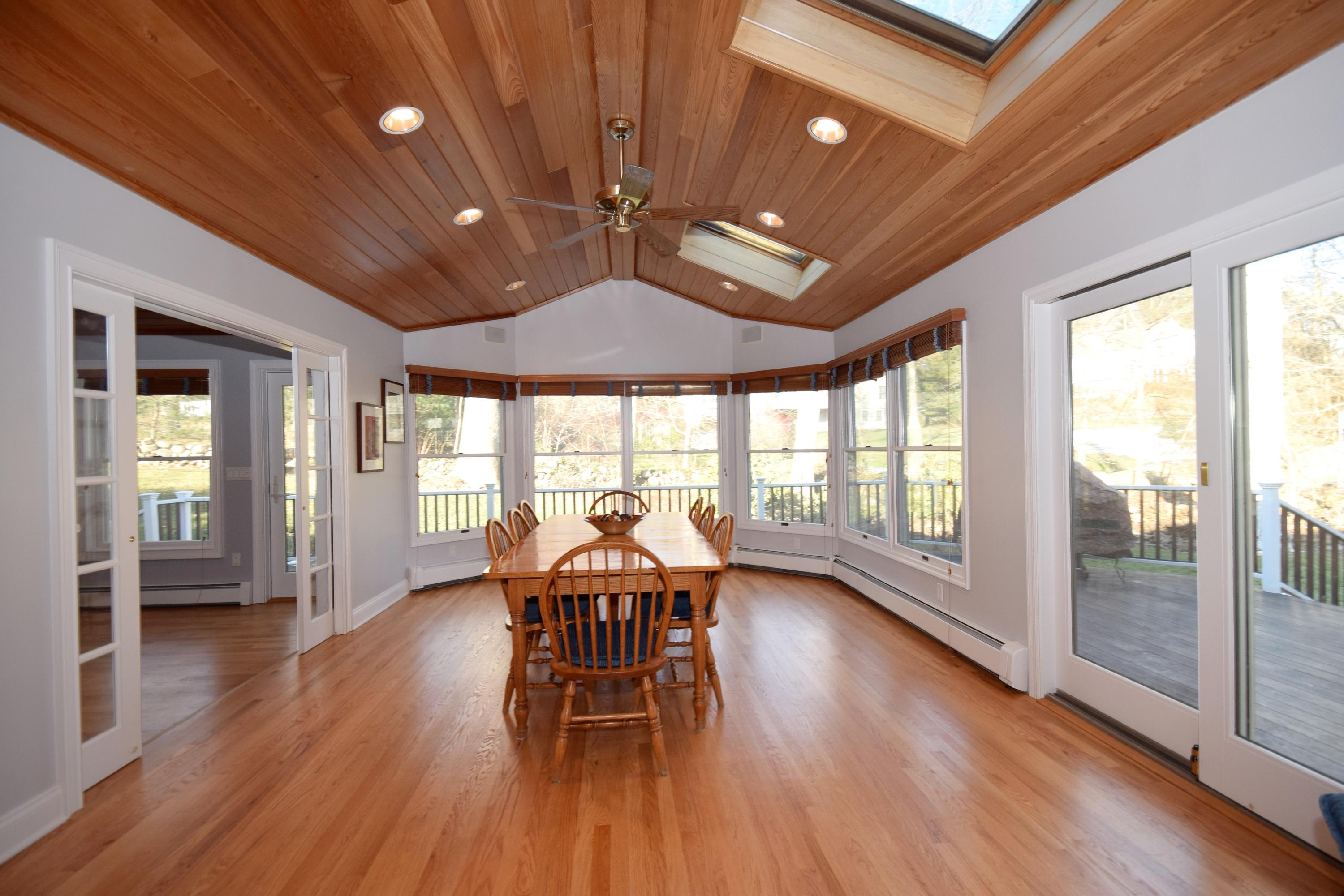 6 Wilson Ridge Road East Darien, CT 06820 - Photo 12 of 25 a view of a dining room with furniture window and wooden floor