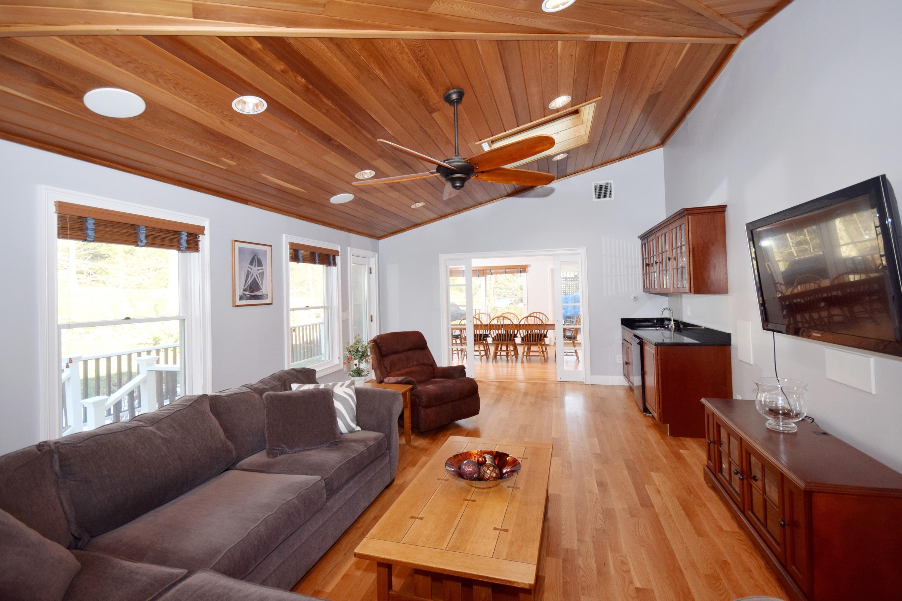6 Wilson Ridge Road East Darien, CT 06820 - Photo 13 of 25 a living room with furniture and a flat screen tv
