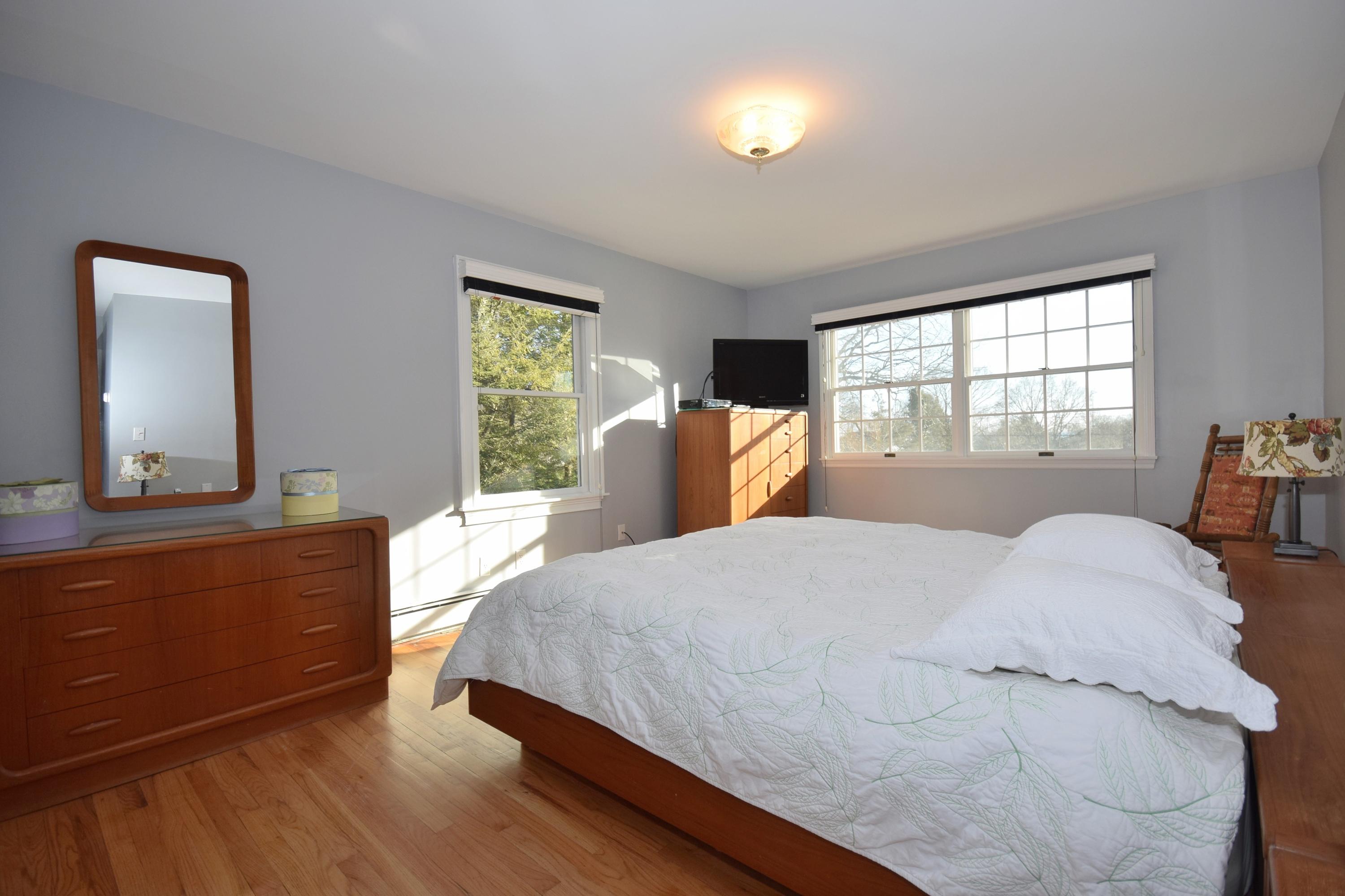 6 Wilson Ridge Road East Darien, CT 06820 - Photo 18 of 25 a bed room with a bed and a dresser