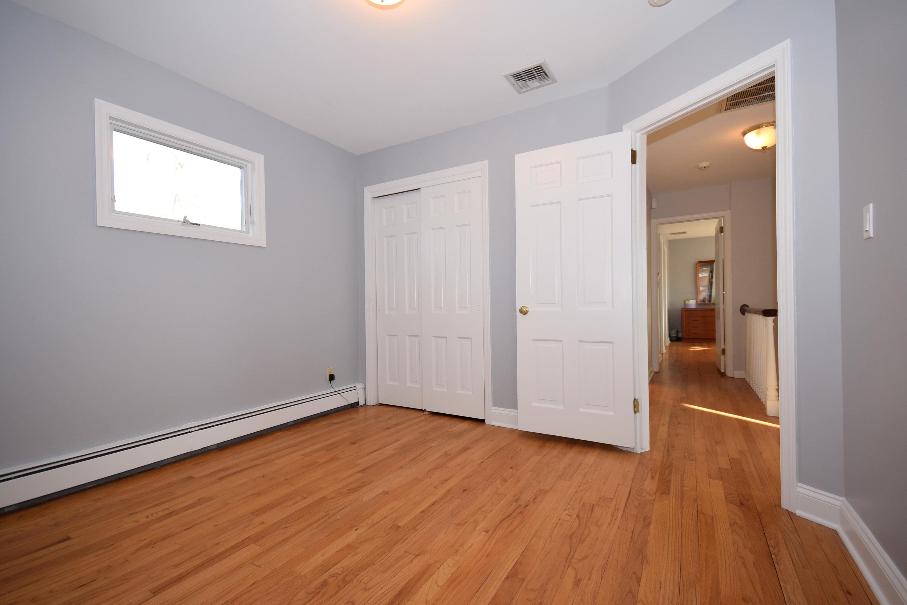 6 Wilson Ridge Road East Darien, CT 06820 - Photo 22 of 25 wooden floor in an empty room with a window