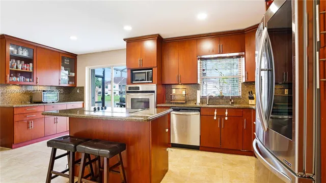 $560,000 | 10717 Northwest 12th Manor, Plantation, FL 33322