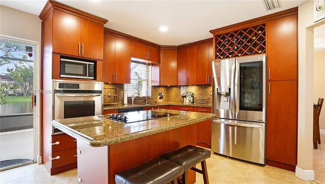 $560,000 | 10717 Northwest 12th Manor, Plantation, FL 33322