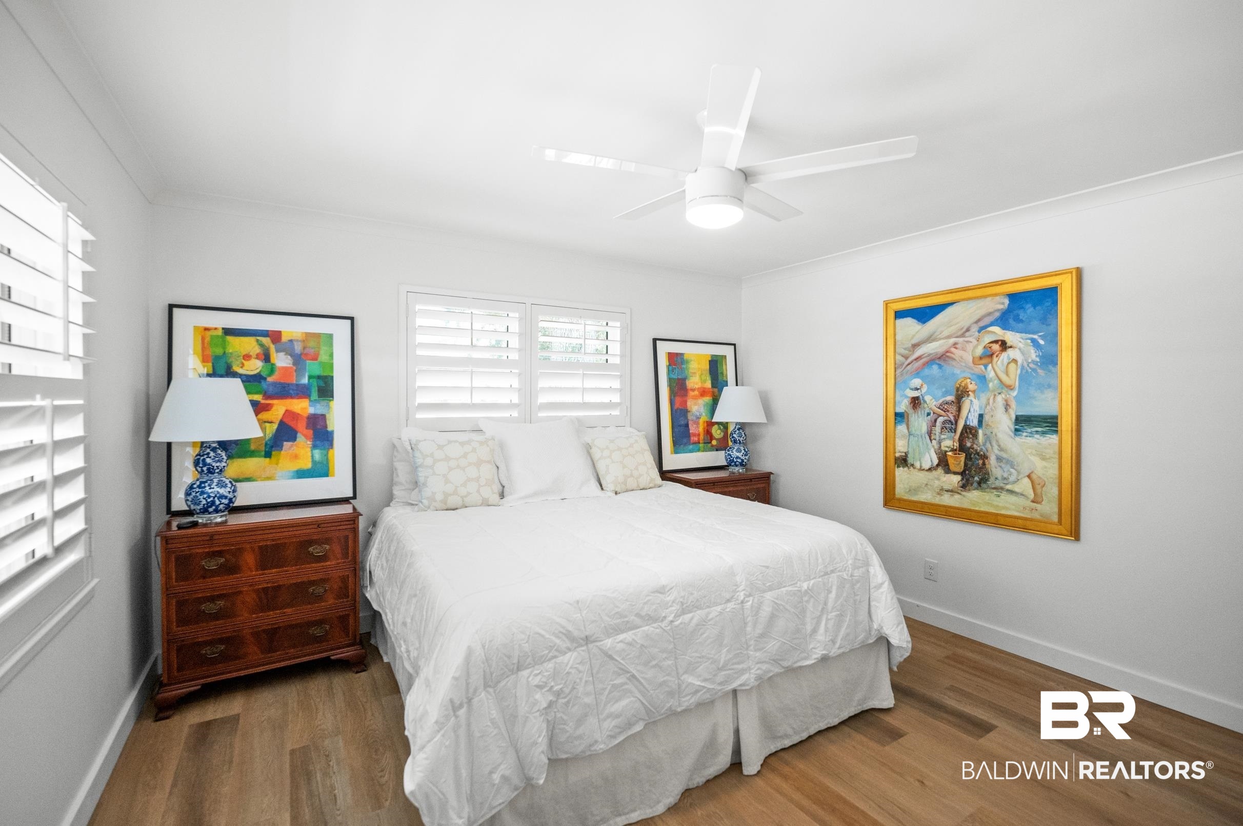 9459 Soldier Creek Road Lillian, AL 36549 - Photo 17 of 54 Bedroom with ceiling fan, wood finished floors, and baseboards