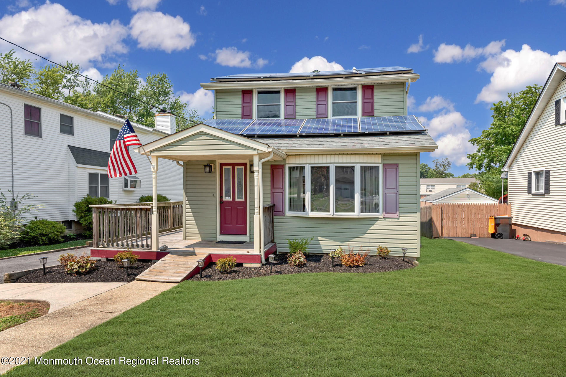 107 Aberdeen Road Aberdeen, NJ 07747 - Photo 2 of 32 a front view of a house with a yard
