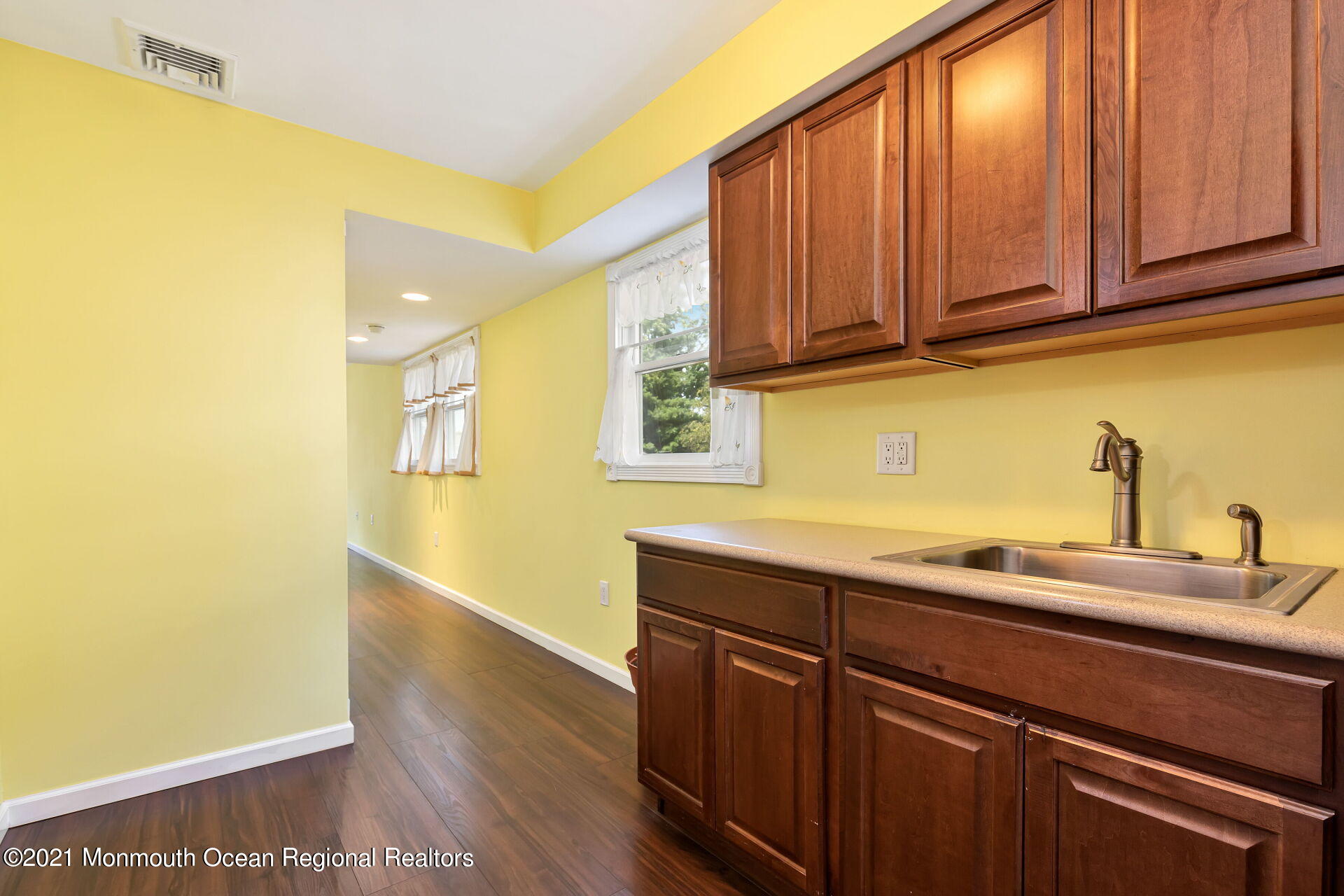 107 Aberdeen Road Aberdeen, NJ 07747 - Photo 12 of 32 a kitchen with a sink and cabinets