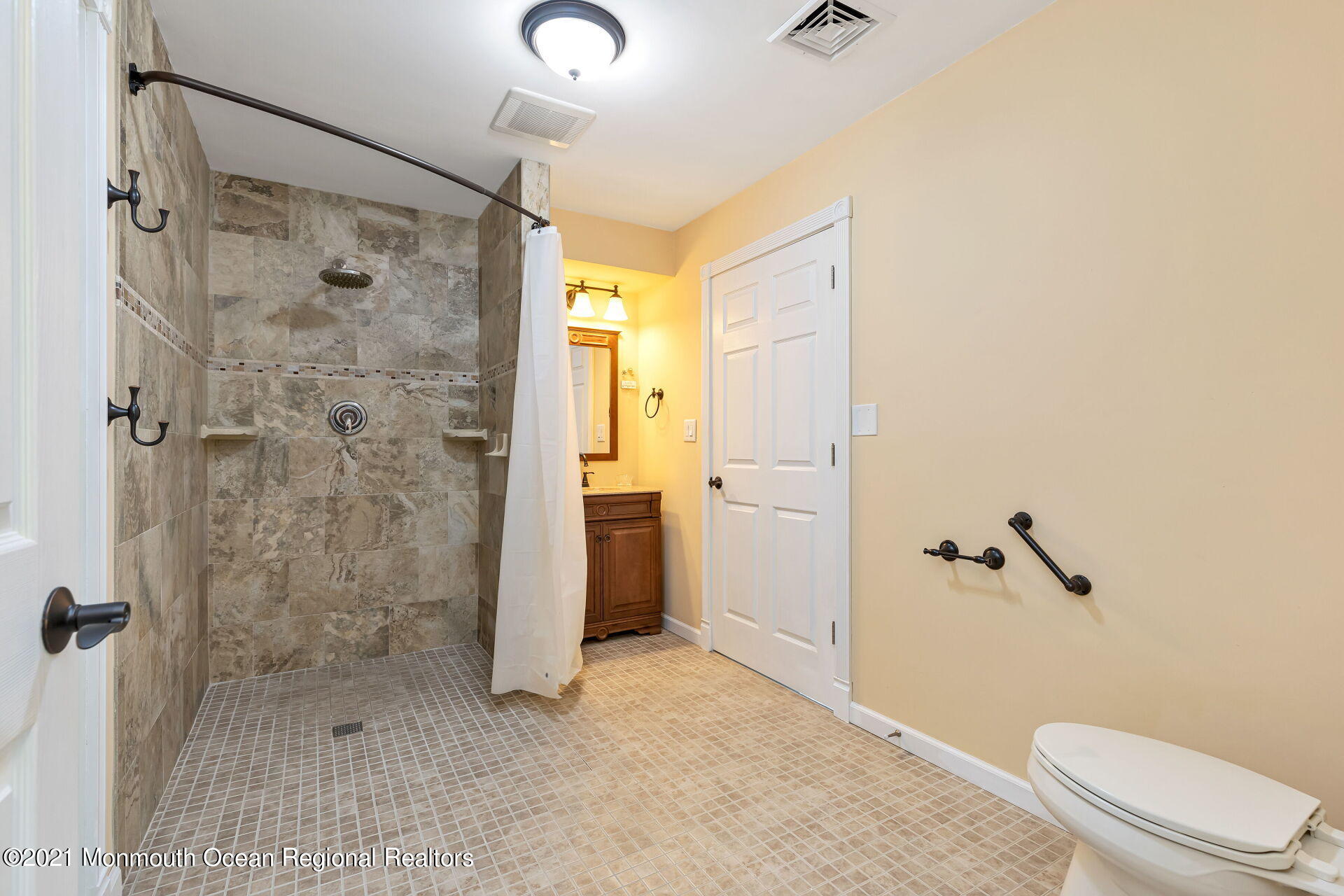 107 Aberdeen Road Aberdeen, NJ 07747 - Photo 13 of 32 a bathroom with a shower and a toilet