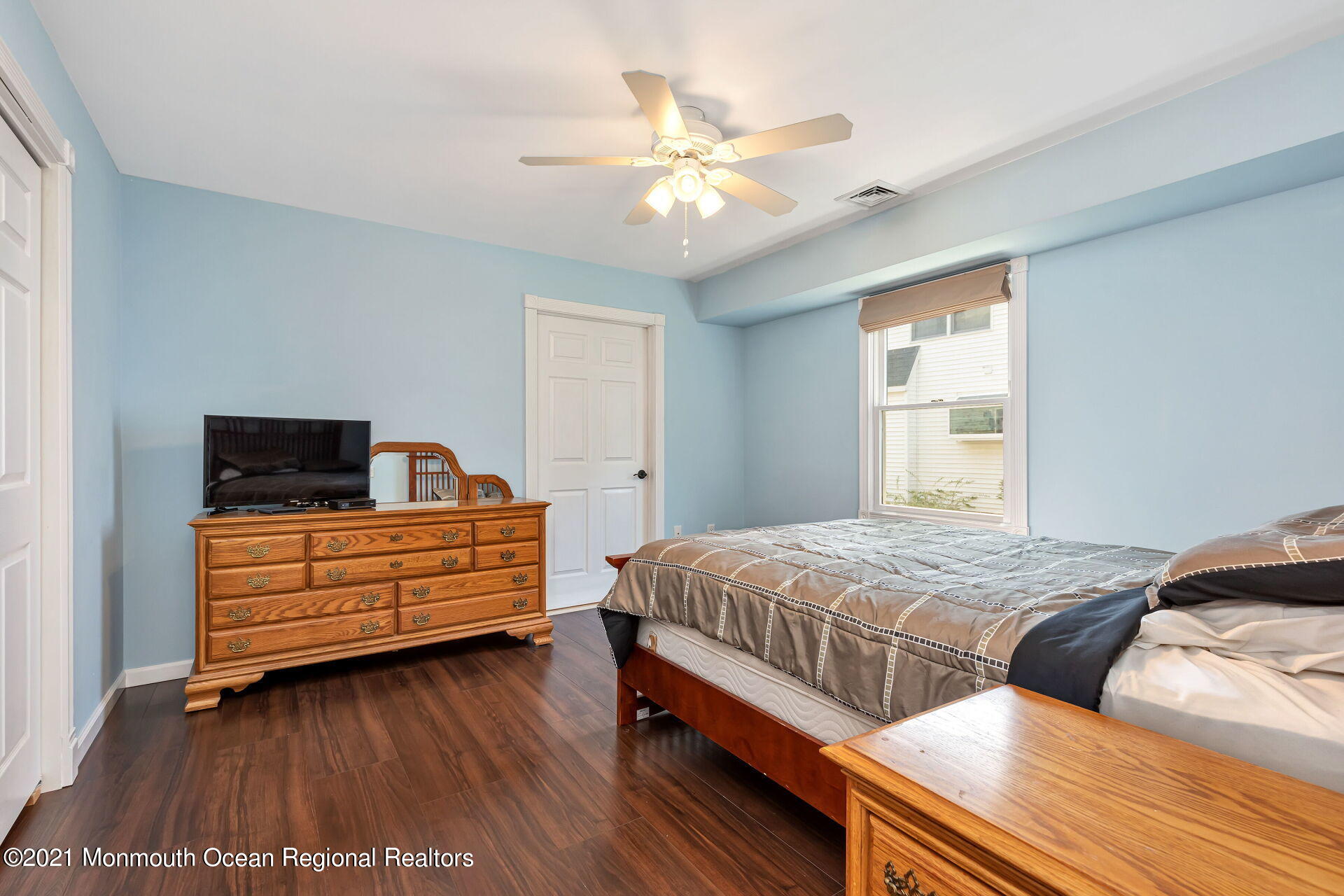107 Aberdeen Road Aberdeen, NJ 07747 - Photo 17 of 32 a bedroom with double bed and a window