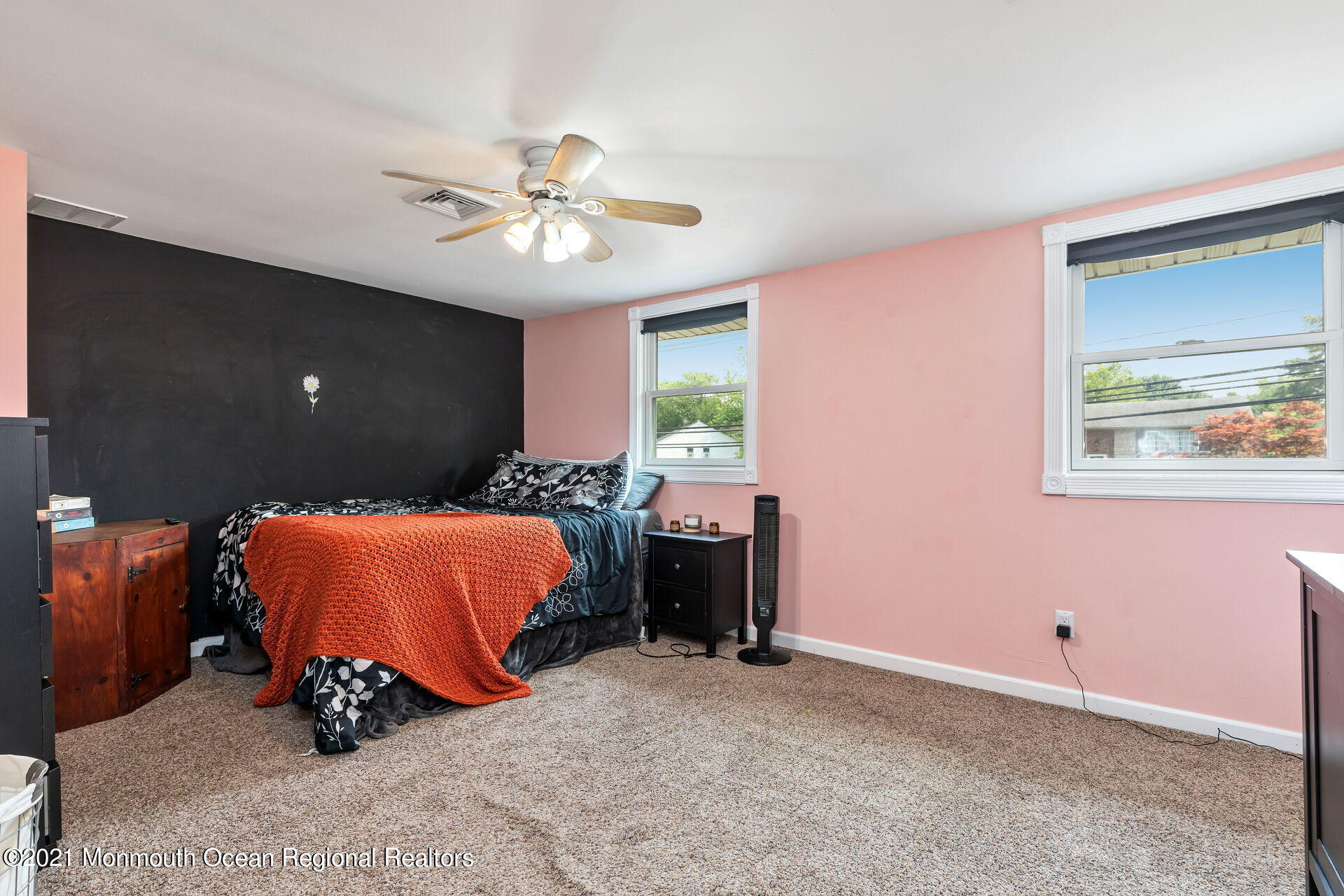 107 Aberdeen Road Aberdeen, NJ 07747 - Photo 19 of 32 a bedroom with a bed and a chandelier