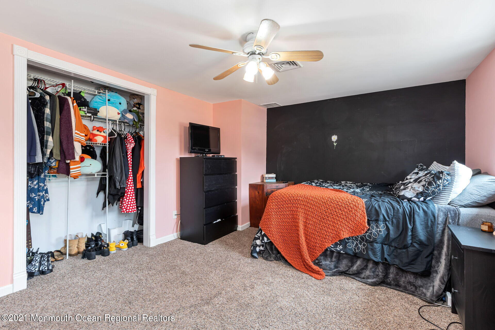107 Aberdeen Road Aberdeen, NJ 07747 - Photo 20 of 32 a bed room with a bed and a ceiling fan