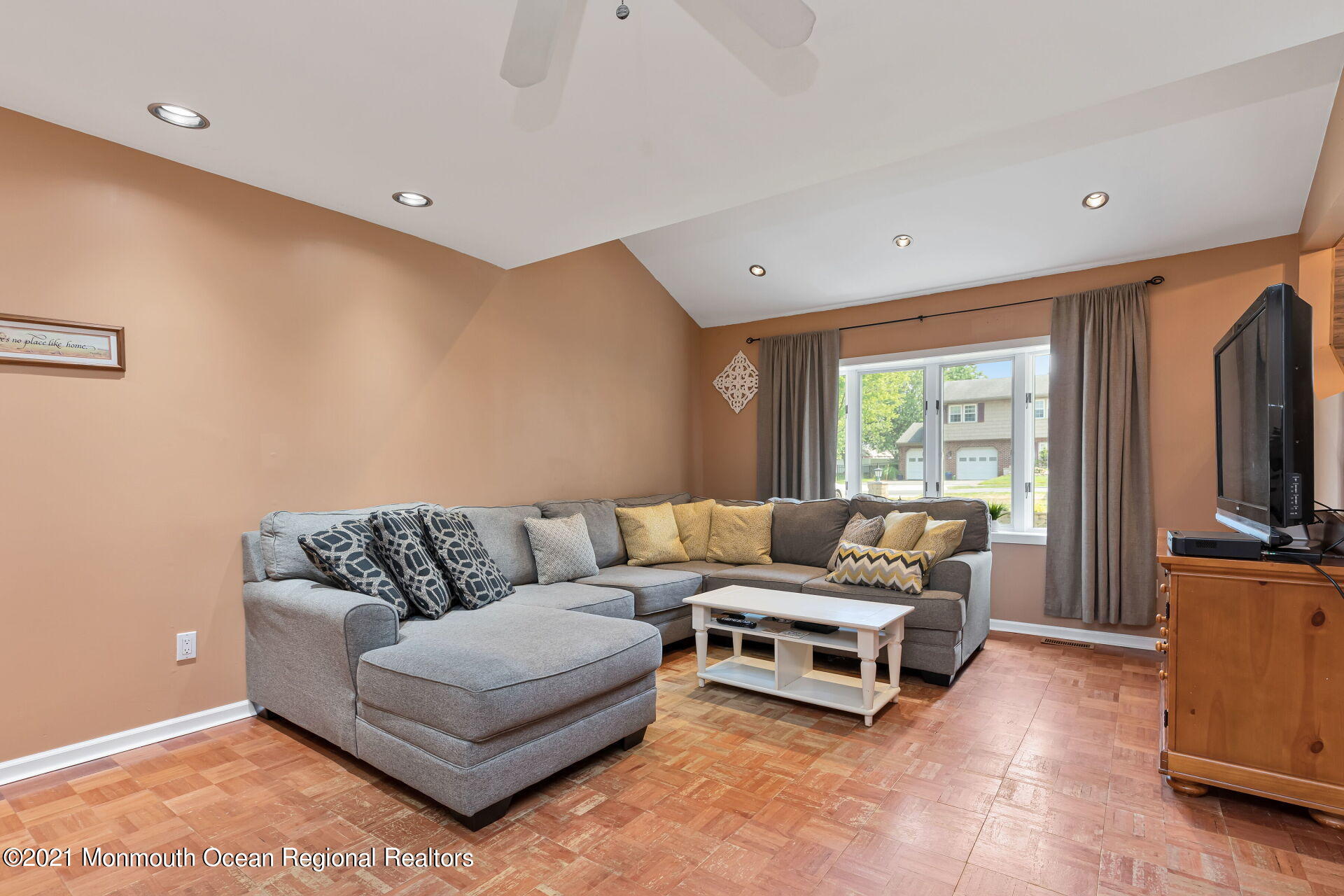 107 Aberdeen Road Aberdeen, NJ 07747 - Photo 4 of 32 a living room with furniture and a flat screen tv