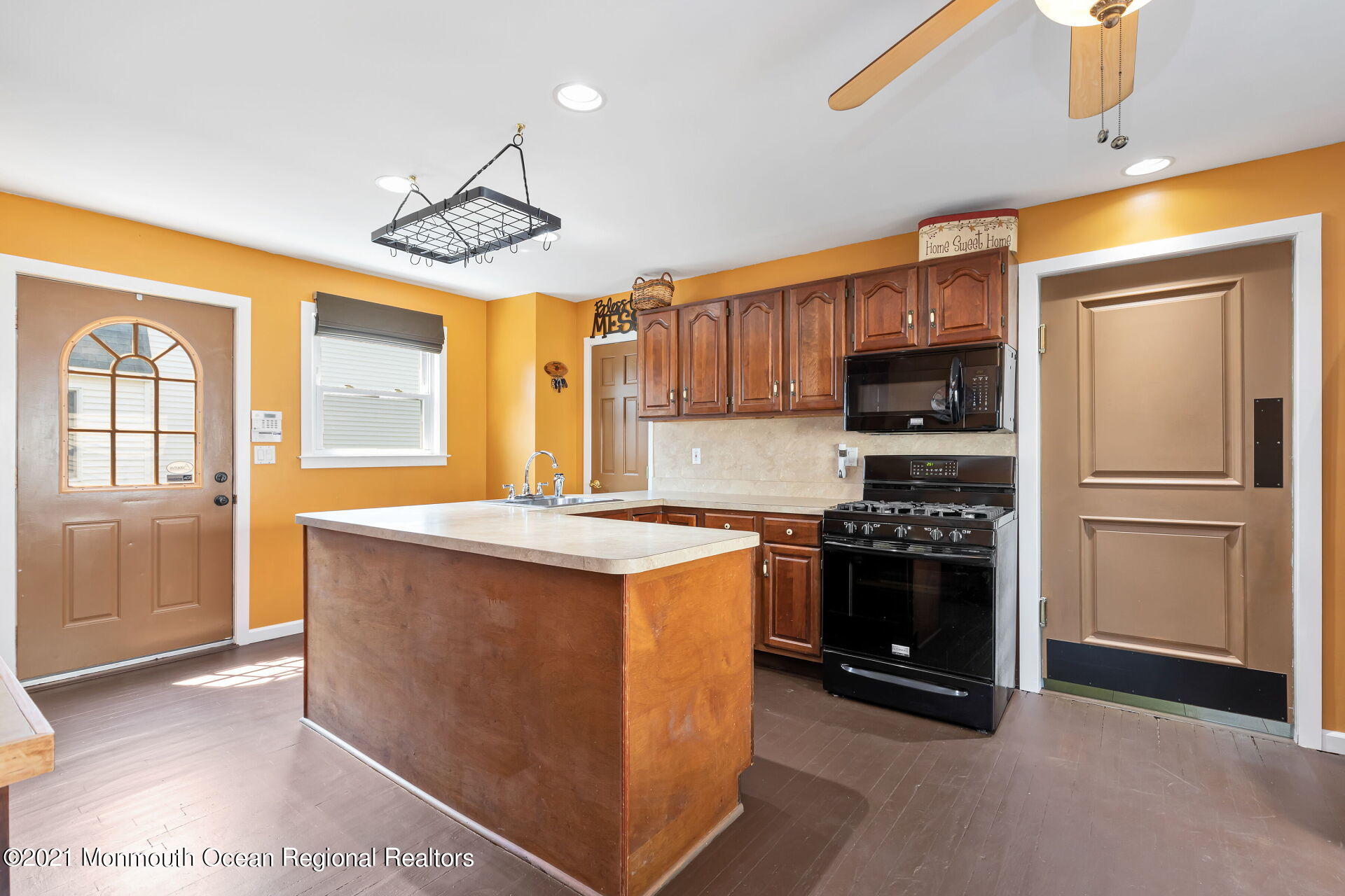107 Aberdeen Road Aberdeen, NJ 07747 - Photo 7 of 32 a kitchen with stainless steel appliances granite countertop a stove a refrigerator and a stove top oven